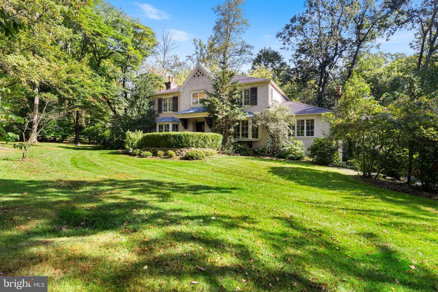 Don’t miss this expansive 5 BD, 4/1 BA French colonial home, in a prime Radnor Township location, just steps from schools and parks, and within walking distance of downtown Wayne!  Scenic, very private, views abound from two rear decks and the sparkling pool. The cul-de-sac setting offers total privacy, since it backs to 20 acres of wooded open space. Inlaid wood floors and a gracious curved staircase enhance the Entrance Hall. Enjoy entertaining guests in the Dining Room and the sunny Living Room, which has ample room for a piano and one of four fireplaces. Upgraded features include extensive millwork, hardwood floors throughout the 1st and 2nd floors, rich paneling, and Ball & Ball light fixtures. The gourmet Kitchen has a stainless farmhouse sink, stainless oven, dishwasher, and island with gas cooktop, downdraft exhaust, and stool seating area. This spacious room also has a Breakfast Area, menu planning desk, access to a spacious Laundry Room, and open views of the very large Family Room. A furniture-style wet bar, vaulted ceiling with beams, fireplace, and wall of custom built-ins accent the bright and spacious Family Room. A large addition, designed by Peter Zimmerman, features a Study/Library/Music Room with built-ins and a corner fireplace. Pocket doors lead to the private Office which has extensive built-ins that will make working from home a pleasure.  The vaulted Primary Bedroom Suite is a luxurious sanctuary with a romantic fireplace, walk-in closet with custom organizers, extensive built-ins, and a Primary Bathroom with deep tub, large double vanity,  dressing counter & cabinets, separate shower, and private room for the toilet. Bedroom 2 is ideal for guests, with an en suite full BA. Bedrooms 3, 4, and 5 share a large Hall BA, which also has a second laundry area. Downstairs is a very large Recreation Room with built-ins, an Exercise Room with 4th full BA, and a large finished Bonus Room. This level also has cubbies and storage cabinets, ideally located near the 2-car Garage. Multiple sets of French doors lead to  two rear decks. Nestled to one side of the rear yard is a refreshing pool with flagstone terrace, designed to look like a pond surrounded by dappled shade trees. The heated pool features a new retractable cover, and there is also a separate jetted hot tub in the pool area. A propane-fueled generator provides peace of mind. Easy access to top-ranked Radnor schools, shopping, restaurants, train station, and events in Wayne. Convenient to Center City, corporate and medical centers, and the Airport.