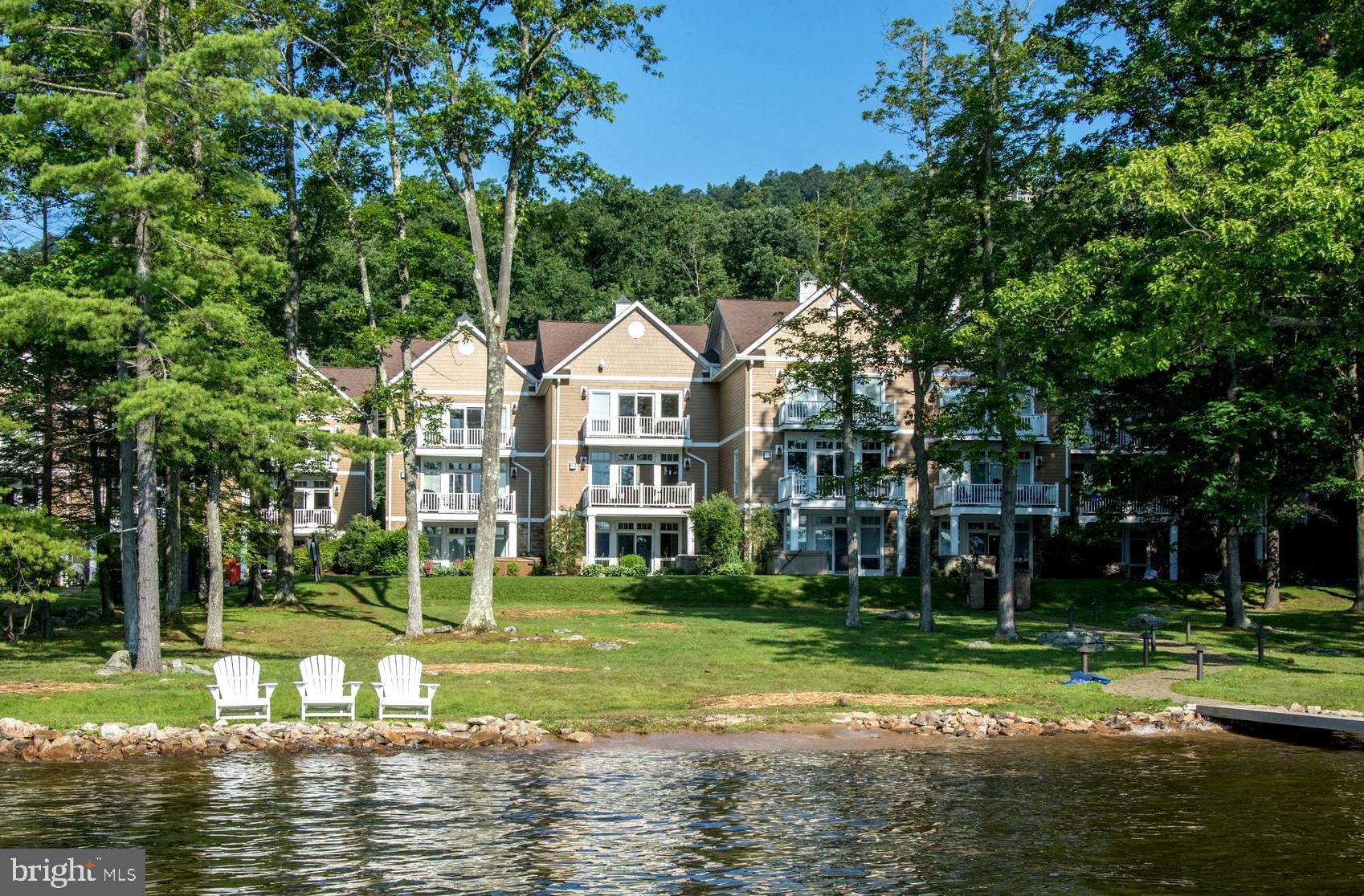 Experience the best in maintenance free lakefront living on Deep Creek Lake! This 4 BR 4 Bath lakefront townhome with assigned dock slip is located within walking distance of many of the lake's best restaurants and attractions.
The open floor plan offers a main level great room and lower level family/game room. The large kitchen offers a lake facing island with breakfast bar. Three private suites and a fourth bedroom, each with direct bath access provide plenty of room for every occasion.
Enjoy the outside amenities including a deck, balcony and covered porch. Amenities include a hot tub, s whirlpools, 2 fireplaces, game tables and a wet bar. The unit offers forced air heating and air conditioning, public water and sewer. Community amenities include lakeside picnic tables and adirondack chairs.
This property is currently a rental with a solid booking history.