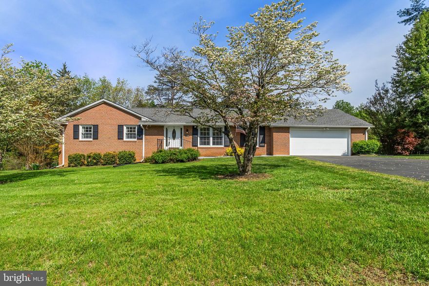 Solid 4-sided brick ranch on over half an acre with NO HOA, backing to trees for added privacy. This well-maintained 3-bedroom, 2.5-bath home features a private primary suite, spacious secondary bedrooms, and a classic layout. The inviting family room boasts a brick fireplace with a wood-burning stove insert and a beautiful view of the backyard. Enjoy meals in the dining room with a large picture window or the eat-in kitchen across from a cozy living room. The full, walk-out basement offers endless possibilities and opens to a flat, usable yard. Oversized 2-car garage includes extra storage, a half bath, and access to a huge partially covered deck. Fenced dog run included! Minutes to Old Town Culpeper and all of its great restaurants!