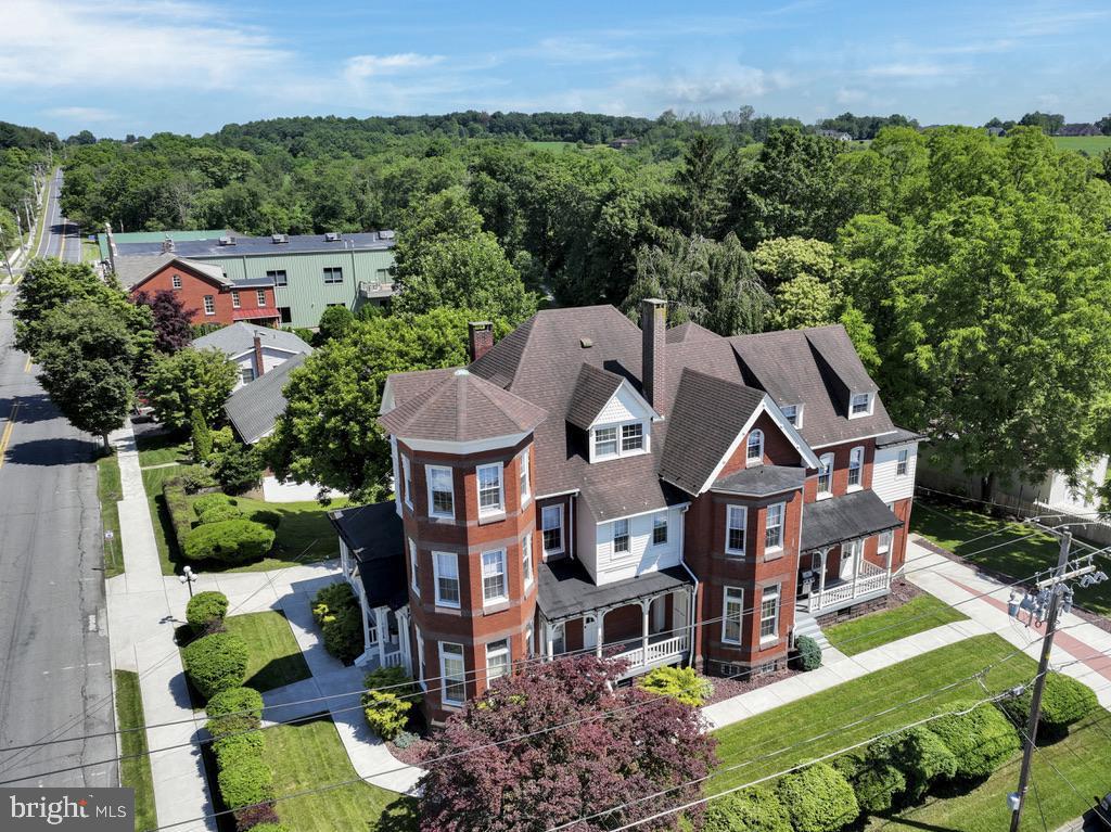 Impressive space for a law office or other professional services with living space. Exceptional old world Victorian era mansion oozes with charming original details including dozens of stained glass windows, 12 foot ceilings, exquisite chestnut woodwork and decorative antique fireplaces all nestled in the delightful small town of Orwigsburg. This executive space includes the entire first floor with over 2000 square feet of living space, 4 porches, and the private use of the driveway and garage. In addition to four expansive rooms that can be used as living, family, bedrooms or office this home features an exquisite kitchen with granite counters, marble flooring, and a counter bar which flows into the large dining area and adjacent laundry room. The main bathroom is enhanced with a garden tub, dual sink and cabinets galore. A large pocket door allows for low-impact professional space in the front with living quarters in the rear. Storage and other space available in the very nice basement (has direct access).
Owner is a licensed realtor.