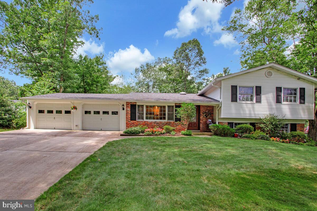 Tucked gently away on a dead end street this four -level split on nearly a quarter of an acre is ready to make this your home! you will appreciate gas cooking, the warmth of the sun rising on the front of your home, floor to ceiling windows and skylights in the great room that overlooks mature perennials in your bountiful garden. On the upper level you will find the primary suite with a walk-in closet and sitting room (which can easily be turned back into a bedroom), two additional bedrooms and bath. One level down from the entry level is a low maintenance brick gas fireplace in your spacious family room, a full bath, office/potential 4th bedroom. laundry and walk-out to the side yard. No worries if you need additional storage for your "extras" there is still one more level to take advantage of sharing space with home utilities and walls lined with storage solutions. The oversize two car garage offers motion sensor lighting , more storage, and natural lighting from both the front door window panes and the rear has full sized windows. The patio is accessible from the garage and great room, has a dedicated gas line for outdoor cooking and a paved walkway around rear of home and throughout the garden. West Laurel is located midway between Washington, DC and Baltimore, MD, has easy access to all major commuting routes, 2 MARC train stations, Ft. Meade, NSA, WSSC along with numerous other major employers. Fishing, kayaking, horseback riding, playgrounds, tennis, soccer and baseball fields can all be found at the Rocky Gorge Reservoir and T Howard Park within a very short distance to our north! The West Laurel Swim Club is a membership-based pool offering swim lesson, evening and weekend activities for all ages.