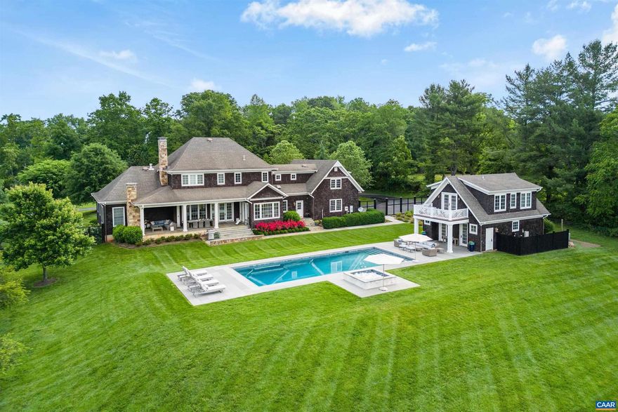 Spectacular, private setting with secure mountain views over a long open field and a superior Ivy location on one of Charlottesville's prettiest country lanes. The Shingle style residence is in immaculate condition with a spacious kitchen and gracious living areas, first floor master, library, dining room , 10+ foot ceilings, multiple fireplaces, gorgeous covered terrace, 3 car garage, and much more. The second level offers 3 more en suite bedrooms, home office and a large family room. Guest/pool house offers another bedroom with full bath and living area upstairs, plus kitchenette, half bath, entertaining area and separate pool shower on main level. Geothermal heat, generator, & alarm system in place.