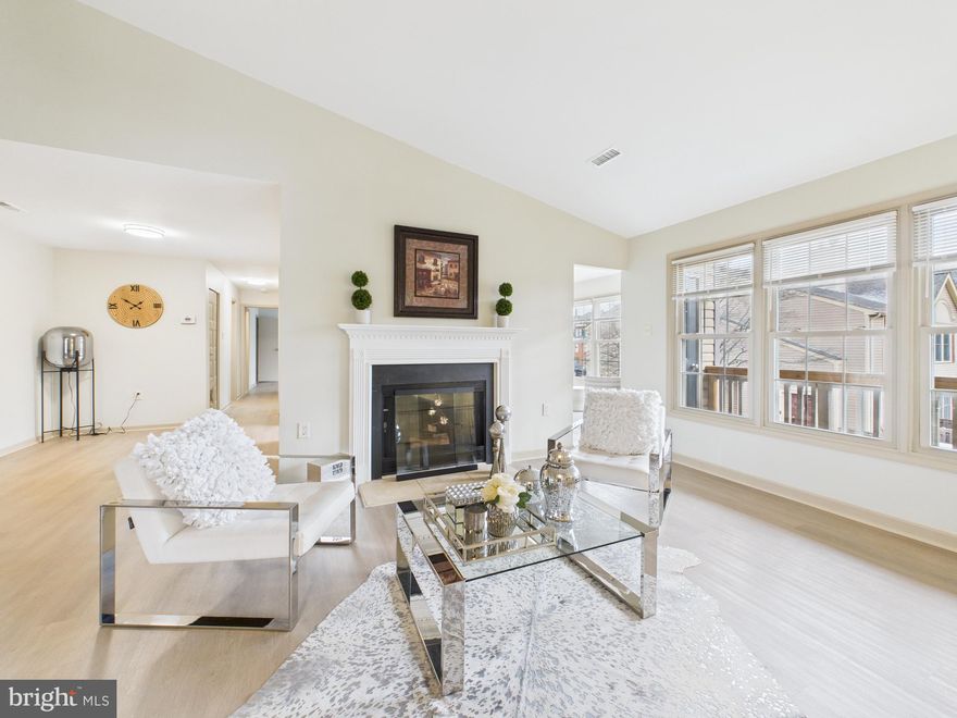 Light-filled and move-in ready, this beautifully refreshed 2-bedroom, 2-bath home offers 1,248 sq ft of comfortable living in a convenient Manassas location, with extensive recent improvements throughout. Step inside to a bright, clean interior featuring fresh paint in the entire home, brand-new wide-plank flooring across the main living areas, bedrooms, and loft, plus new lighting fixtures and modern chandeliers that elevate the look and feel. The spacious open living and dining area is perfect for everyday living and entertaining, highlighted by a cozy fireplace and flexible layout options. A versatile loft/flex space overlooking the entry adds extra functionality—ideal for a home office, reading corner, or hobby space. The updated kitchen offers a sleek, contemporary design with new high-gloss gray cabinetry, granite countertops, a coordinating backsplash, new appliances, and durable tile flooring, along with a bright eat-in area that enjoys great natural light. Both bedrooms are comfortably sized with large windows and new flooring, and the primary bedroom features a walk-in closet with custom wood shelving for organized storage. The two updated bathrooms have been refreshed with modern vanities, updated lighting, and updated flooring, creating a clean, move-in ready feel. Enjoy community amenities including a pool, tennis courts, basketball court, and a toddler playground, plus the convenience of two assigned parking spaces and additional guest parking. All of this is close to shopping, dining, and major commuter routes including I-66 and Route 234, making daily errands and commuting easy.