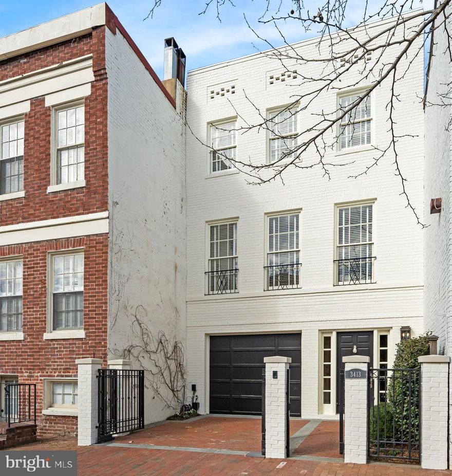 Gorgeous renovation of this spacious 2+ Bedroom townhouse with attached garage & additional parking. Open main level w/ dining room and living room, wet bar, balcony and gas fireplace. Gourmet, eat-in kitchen with top-of-the-line appliances. Entry level features a full bath and family room/third bedroom with wet bar and patio access. Large rear patio and garden w/ fountain, detached solarium/studio.