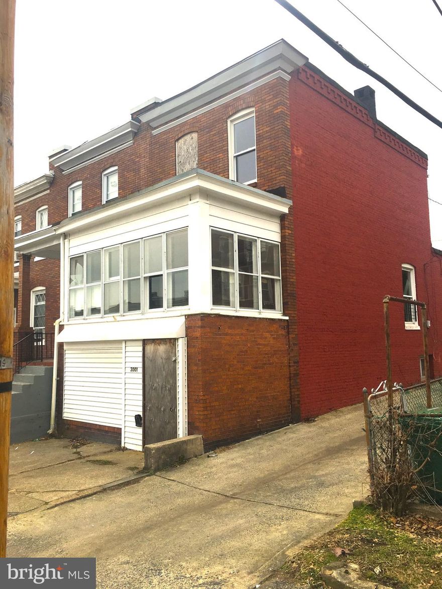 INVESTORS: Spacious end of group townhouse, steps from Herring Run Park.  Covered front porch sun. 2 bedrooms, 1 bath upstairs. Walkout basement with full bath. As-is sale. Solid house, but needs work.