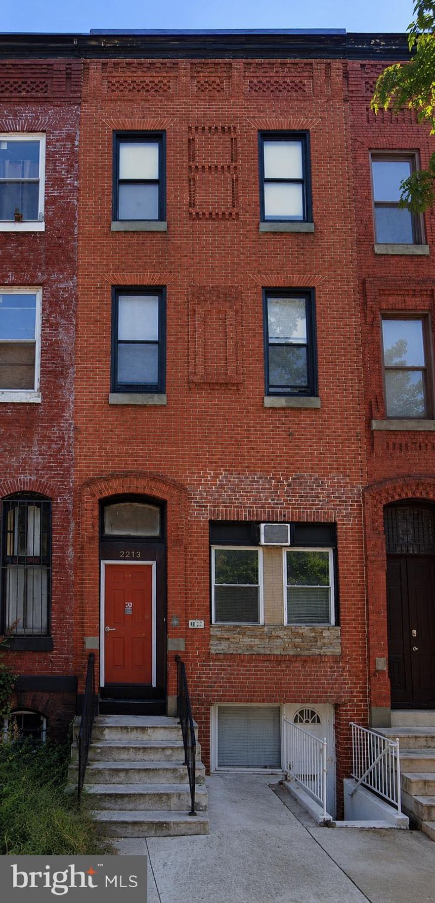 Turnkey mixed-use investment opportunity in the heart of Old Goucher, nestled between Charles Village, Remington, and Station North. This four-story brick building delivers immediate cash flow from three 1-bedroom apartments and a ground-floor commercial space currently operating as a private club.

Each of the three residential units is a well-appointed 1-bedroom with its own electric meter, individual heat pump, and dedicated water heater — keeping utility management simple and expenses predictable. Every residential unit is plumbed and ducted for an in-unit washer/dryer, a highly sought-after amenity that supports premium rents and strong tenant retention.

Two of the three apartments are currently leased at $1,080.75 and $1,135.00/month, respectively, with one unit vacant and ready for your finishing touches — lease it immediately at market rate or move in yourself. The ground-floor commercial space is leased to a private club at $750.00/month. C-1 (Community Commercial) zoning supports a broad range of future uses — food and beverage, retail, office, and personal services — providing long-term flexibility. The space is independently climate-controlled with a ductless mini-split system.

The location is exceptional for tenant retention: a Walk Score of 95, Transit Score of 70, and Bike Score of 90 make this one of the most accessible addresses in the city. High visibility on a busy commercial corridor supports strong demand for the retail space. Close to John Hopkins and public transportation.