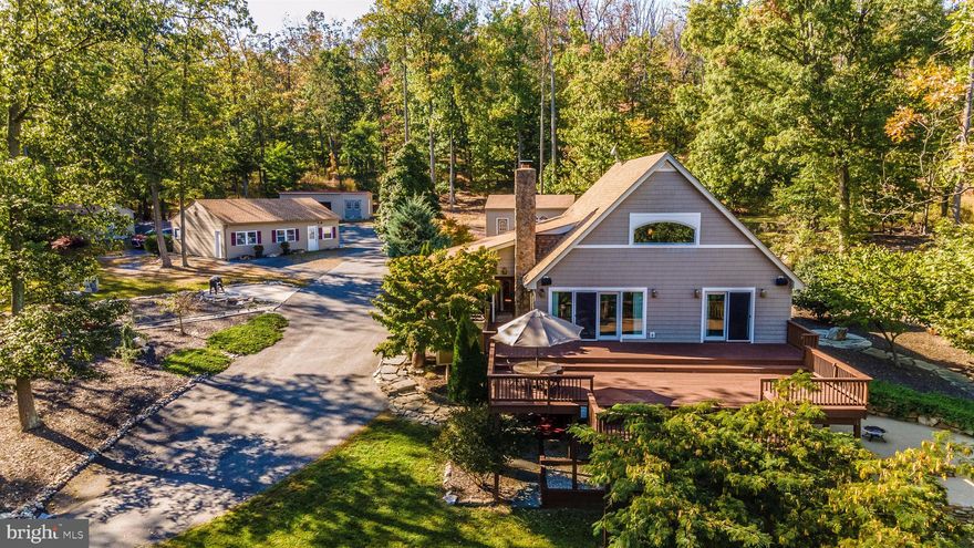 OPEN HOUSE CANCELLED.  Offer deadline 6 PM Friday October 16. CATOCTIN COVID RETREAT less than an hour from Washington, DC and merely 15 minutes from downtown Frederick! Fabulous, secluded 30 wooded acres teaming with mountain wildlife. Custom-built, open and airy contemporary deck-style home recently updated and upgraded; vaulted ceilings, massive stone fireplace; large light-filled dining room; open concept kitchen/family room with center island that seats 4; screened-in porch for morning coffee and watching the birds and wildlife; huge entertaining deck to enjoy the sunsets; main bedroom with sliders to deck and 4-piece en suite with soaking tub; loft bedroom/office with extensive built-ins and full bath; walk-out, above grade, lower level with kitchenette, patio, bedroom and full bath. Pool with waterfall, dining area and cabana with full bath and plenty of room for extra guests. Attention car collectors! Detached 2-Car Garage with insulated room perfect for workshop or studi; multiple other outbuildings. Extensive hardscaping, built-in firepit ? perfectly for chilly autumn nights! Property is deeded as two lots; the undeveloped 14-acre parcel perks for 6 bedroom house gives the property potential as a family compound or more.