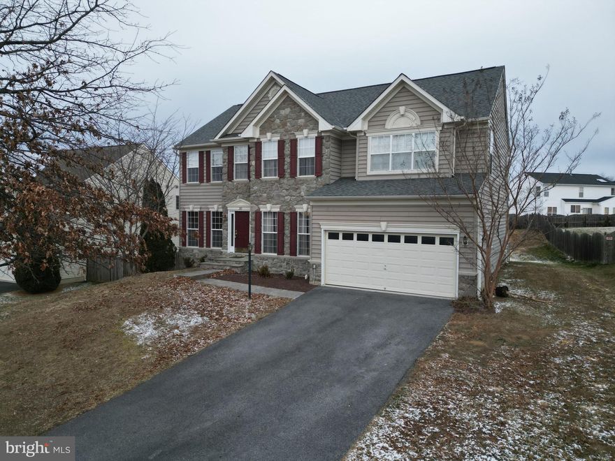 Spacious 5-bedroom 3.5 bath home offering over 4,100 sq ft of living space! This home features a family room with cathedral ceiling and fireplace looking into a large open eat in kitchen. The primary suite features a tray ceiling with a walk-in closet.  Additional highlights include spacious sunroom, multiple living areas, generous bedrooms, and flexible spaces for work or play. Conveniently located near schools, shopping, and commuter routes. Newer roof, HVAC, water heater, and water treatment system.