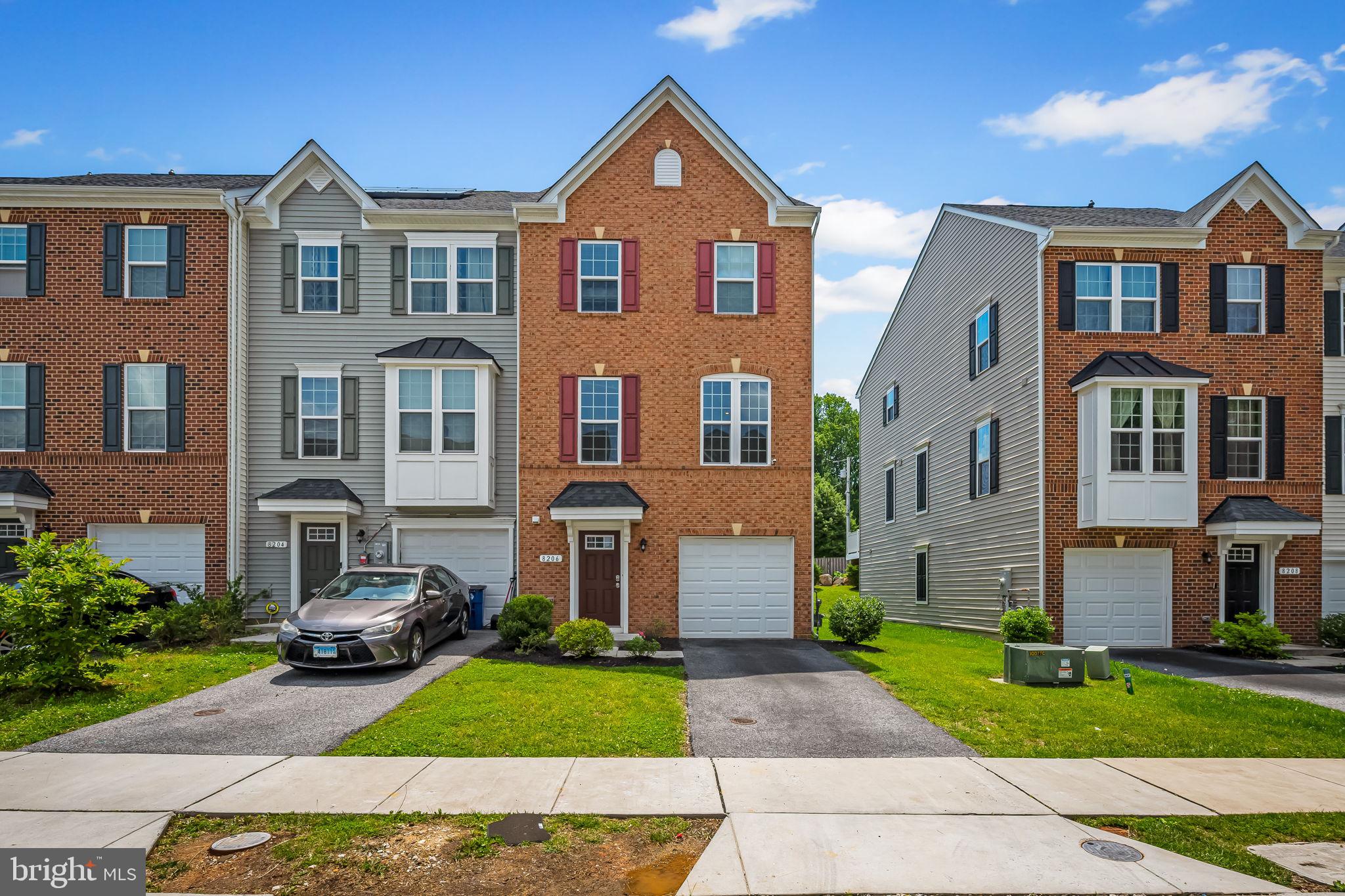 This expansive end-unit townhome in Rockdale Village features over 2,320 square feet of beautifully updated living space and a timeless brick exterior. Inside, freshly painted walls, upgraded flooring, and streams of natural light create a warm and modern atmosphere.
The entry-level includes a welcoming foyer, a flexible rec room or home office space, a half bath, interior access to the garage, and a walkout to the private rear yard—perfect for relaxing or gardening.
Up one level, the open-concept main floor features luxury vinyl plank flooring and recessed lighting. A sunlit living area flows seamlessly into a spacious dining room and a well-equipped kitchen, complete with granite countertops, 42” white shaker cabinetry, stainless steel energy-efficient appliances, a walk-in pantry, and a large island with breakfast seating and stylish pendant lights. A sliding door leads to a low-maintenance deck ideal for outdoor dining or lounging.
The upper level hosts the generous owner’s suite, complete with a tray ceiling, walk-in closet, and a private bath. Two additional bedrooms, a full hallway bath, and a dedicated laundry area round out the top floor—offering comfort and convenience for today’s lifestyle.
Located near shopping, transit options, and major commuter routes, this home blends style, space, and accessibility in a highly desirable community.