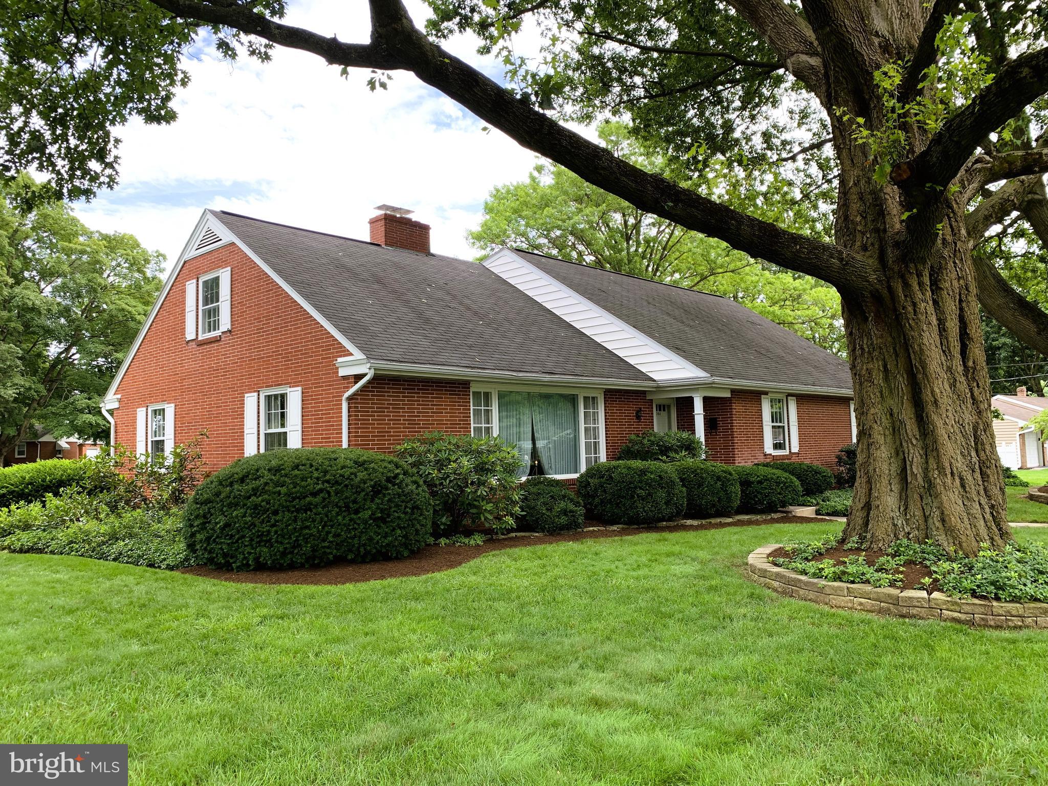A rare opportunity to own a true gem in the heart of Lititz!!! This thoughtfully-designed 3,500 sq. ft. custom Cape Cod home features solid brick construction, original hardwood floors and hand-built cabinetry, first floor primary bedroom/bath, a bright and functional kitchen, custom touches throughout, storage space galore, two fireplaces, a large covered breezeway/patio, an oversized 4-car garage with half bath, a versatile 975 sq. ft. 1-bedroom/1-bath apartment with full basement and private parking lot, and a tranquil backyard with white picket fence. Ideally located to partake in all that Lititz has to offer… it’s close to parks, library, rail trail, and an easy 15-minute stroll to downtown shops and restaurants.
Built in 1961, the home features a highly-livable layout with a wonderful flow. The first floor showcases a large well-appointed upgraded kitchen with painted white original custom cabinetry, satin nickel cabinet pulls, quartz countertops with undermount sink, tile backsplash, and under-cabinet lighting that still retains its craftsman-style charm. The adjoining large dining room will comfortably host generations for family gatherings and opens up to a grand living room with an expansive picture window (with view of Linden Hall horse pasture across the street), wrap-around brick fireplace, and built-in library bookshelves. Upscale touches in the living and dining rooms include crown molding, custom accent lighting above all windows, and recessed accent lighting for the fireplace and bookshelves. Continuing on the first floor, you’ll find the large primary bedroom with dual closets and private bath, an additional bedroom, a full bath with dual sinks and linen closet, a sizable den with original pine wood paneling and built-in desk, an oversized laundry/mud room, and a walk-in cedar closet. Notable original custom features include a foyer wall clock with doorbell chimes, door jamb light switches that automatically turn on/off the lights in the cedar closet, foyer closet, and primary bedroom room closets, and the laundry room has a laundry chute from the upstairs bathroom integrated into the cabinet next to the washer. The second floor features two nice-sized bedrooms, a full bath, ample closet space, and a large storage room/attic. The one upstairs bedroom has convenient direct access to the full bath, and the other bedroom has an attached bonus room that could be used as a sitting room, an exercise room, a huge walk-in closet, or a 5th bedroom with privacy violation… lots of options. The main basement provides an additional 2,200 sq. ft. of space, divided smartly into 3 different areas, and even has a brick fireplace!
A true breezeway (where there’s always a pleasant breeze!) connects the main house to the garages and apartment. The breezeway includes a 475 sq ft. concrete patio, outside wood stove, and covered walk-way with access to each of the two 2-car garages—one measuring 23’ x 24’ and the other 33’ x 28’ with its own half bath. Both garages share the heat/AC system for the apartment… car enthusiast heaven!
At the end of the 4-car garage complex, you’ll find a beautiful 975 sq. ft. apartment. Fully remodeled in 2010, the 1-bedroom/1-bath apartment was designed with numerous accessibility features such as wider interior doors, lower light switches, walk-in shower, and hard surface flooring throughout. The simple floor plan includes a versatile combined living/dining/kitchen area, one bedroom, a generously-sized bathroom, and a separate laundry room with added storage. Under the apartment, there is a full basement with 10 ft ceilings and separate interior and exterior access. Ideally suited for an in-law’s quarter, in-home business, artist studio, or rental for extra income, the apartment has its own private exterior entrance, 5-car parking lot, and access to the garages.
Schedule your private showing today…
(Note: Seller is also the listing agent)