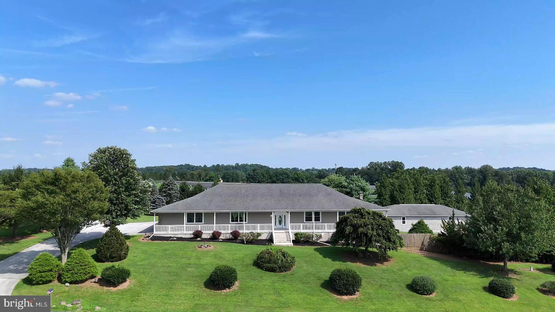 Welcome to 2603 Flintstone Road, an exceptional custom rancher in the sought-after Hereford School Zone, ideally located just 30 minutes from Towson and 25 minutes from York, PA. Built in 2002 and thoughtfully updated, this one-of-a-kind home is nestled on 2.6 beautifully landscaped acres and offers over 250 feet of covered, wrap-around porch — perfect for outdoor living in every season.
Inside, the home impresses with 10-foot ceilings, abundant natural light, and high-quality finishes throughout. The spacious family room features oak flooring, three ceiling fans, and flows seamlessly into the oversized eat-in kitchen with granite countertops, white wood cabinetry, and a full suite of 2024 stainless appliances including a built-in microwave, wall oven, cooktop, and refrigerator. A bright office with French doors opens to the porch, ideal for remote work or creative pursuits.
The private bedroom wing includes three generously sized main-level bedrooms, including a primary suite with porch access, new carpet (2024), and double vanities and a walkin/roll-in shower. A main-level laundry area with barn doors and full LG washer/dryer adds convenience.
The expansive lower level offers incredible versatility, with a fourth bedroom, full bath, second kitchen and family room — ideal for multigenerational living or guest quarters. Additional highlights include multiple utility and storage rooms, a half bath, car run display space. Original owner displayed 8+ classic cars in this huge basement area. There is a large bonus room over the garage with new Bosch CAC/Heat pump (2025) — perfect for hobbies, a studio, or private office. Original owner displayed collectibles in this large open space
Enjoy incredible garage space with a 3-car attached garage plus a 60’ x 30’ heated detached block garage with 14-foot ceilings, a pellet stove, and loft storage — perfect for car enthusiasts, contractors, or hobbyists.
Major updates include:
2025 replacement windows
2024 Buderus boiler & Riello burner
2024 Bosch heat pump
2018 roof
400+ amp electric
Xfinity internet
Extensive ceramic tile details, pocket doors, transom windows, and more
Truly a rare find — private, spacious, and meticulously maintained. Don’t miss this incredible opportunity in northern Baltimore County.
