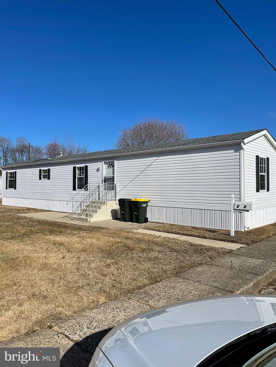 Large two bedroom, 2 full bathroom home. Central air. Front patio. Newer gutters, skirting, flooring, paint, appliances, kitchen counter and backsplash.