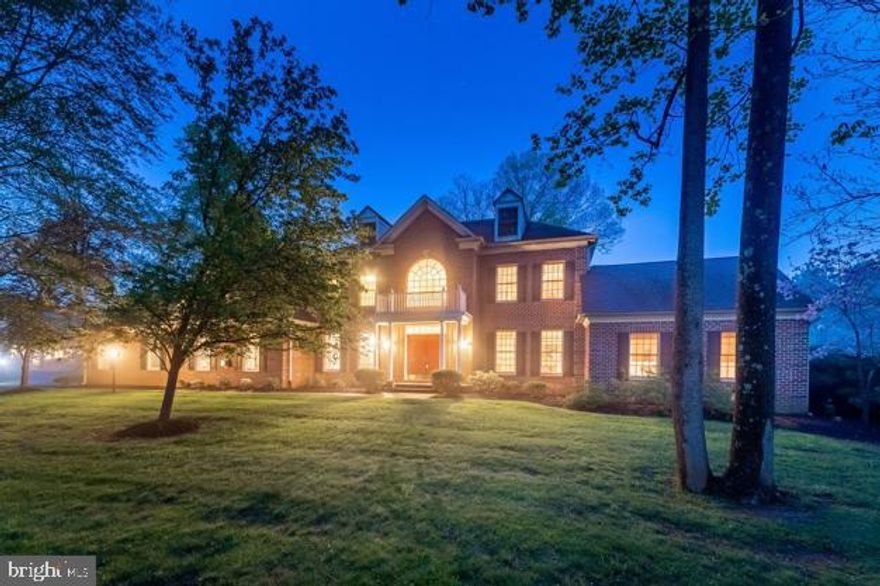 This stunning, freshly painted custom-built brick colonial home, situated on a private 1.56-acre lot in the highly desirable Bullock Farm community and boasting over 7800 finished square footage, offers a perfect blend of elegance and modern upgrades. Surrounded by mature trees that provide exceptional privacy, this property features a heated in-ground saltwater pool with a built-in Jacuzzi, extensive hardscaping, and a beautifully landscaped, tree-lined backyard—ideal for both relaxation and entertaining.

Inside, the grand two-story foyer introduces an open, light-filled layout. Gleaming hardwood floors, crown molding, and large windows set a sophisticated tone throughout. The gourmet eat-in kitchen has been recently updated with a new range and cooktop, complemented by stainless steel appliances, granite countertops, a center island, and a butler’s pantry. New kitchen and dining room flooring and updated lighting features (September 2024) modernize the space, which flows seamlessly into the great room with its double-sided brick fireplace, built-in cabinetry, and breathtaking views of the private backyard oasis.

The sunken family room is perfect for hosting guests, featuring a stone fireplace, tray ceilings, box wainscoting, and a stately bar. The main level also includes formal living and dining rooms, a private office, a billiards room, and an impressive library with custom built-ins and a double-sided fireplace. A full bath, powder room, and laundry room complete the first floor.

Upstairs, the luxurious owner’s suite boasts a sitting room, walk-in closet, and spa-inspired bath with double vanities, a soaking tub, and a glass-enclosed shower. Three additional bedrooms, all freshly painted with new carpet, and three updated full baths complete the upper-level living quarters.

The fully finished lower level offers a recreational space, custom wine cellar with brick flooring, theater room with stadium seating, an exercise room (installed January 2024), and a powder room.  Energy-efficient LED lighting has been installed, and seven flat-screen TVs will remain with the property.

The heated saltwater pool, recently upgraded with a new motor and filters, is complemented by included pool furniture, creating a ready-made outdoor entertaining space. 

Experience the best of Maryland living with luxury, comfort, and modern convenience.