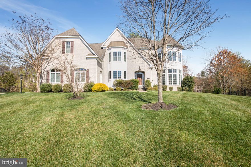 Welcome to the exclusive Woodmore North Estates where you will find this elegant estate tucked away on a cul-de-sac backing to trees.  Upon entering the front door you are greeted by the grand foyer with arched hallway openings and an open formal living room.  The main level features a gourmet kitchen, with double wall oven, butlers pantry with microwave, walk-in food pantry, and gorgeous formal dining room. Just off the kitchen, you can cozy up with a good book and enjoy a cup of coffee/tea in the sunroom that is filled with the most amazing views of your wooded backyard.  Working from home? The large corner office with built in shelves is delightful.  The sunlit two-story family room with fireplace + built-ins, the heart of the home completes the main-level nicely.  Upstairs you will find the over-sized primary suite with sitting room and luxurious spa bath with dual rain shower heads + relaxing bench, spa tub, dual vanities, dressing area leading to beautifully designed walk-in closets, PLUS the possibility to add a balcony/porch just off of the sitting room.  The THREE additional bedrooms on the upper level include a the well lit guest suite with large walk-in closet and ensuite bath + two additional bedrooms with backyard views connected by the third shared bath featuring a private vanity area for each room.  The lower level can be finished to meet your dreams, it can accommodate a full bathroom (rough in present), a bedroom, movie theatre, gym, den, additional office space whatever your heart desires. Walkout the lower level to platform deck perfect for entertaining , making s'mores and more!  Schedule your home tour today.