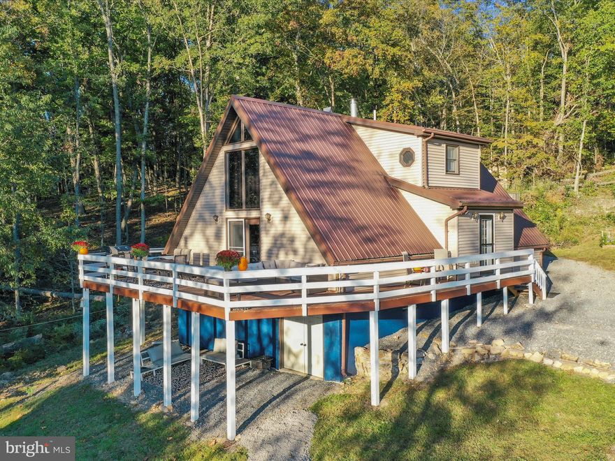 Come and see this spacious cabin with one of the best views in Augusta, WV! The property boasts over 5.5 acres of property with easy access to Delray Rd. The highlight of the cabin is the oversized wrap around deck with a breathtaking view! The home has new flooring, fresh paint, new deck boards, updated bathrooms and kitchen. Each level of the home has a large bedroom and a full bathroom. The upstairs master bedroom has its own walkout deck to enjoy the view and fresh air. For bonus indoor space, the basement is over 1000 sq ft and has a level outdoor entrance. There is a wood stove in the basement for supplemental heat on those extra cold nights. A new shed will convey with the property. The location of this property is 28 miles from downtown Winchester, VA and 16 miles from downtown Romney, WV.