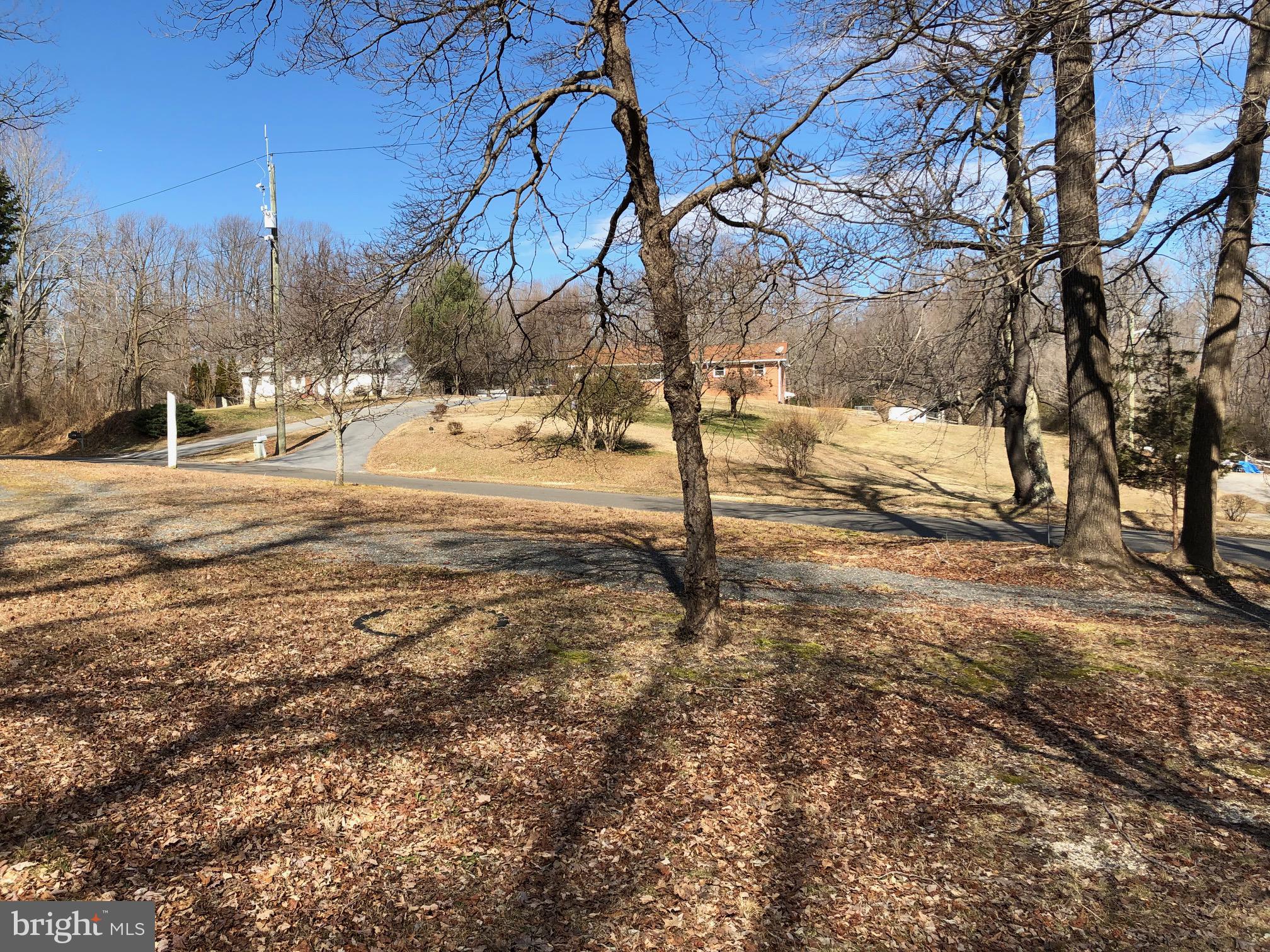 Beautiful 5+ acre property setting on a small knoll overlooking the area*Level home site surrounded by mature hardwood trees sitting back nicely from Van Brady road*The additional land beyond the house site area slopes down on both the left side and back of the lot*200+ road frontage on Van Brady road with current driveway on the right side of the lot*no HOA Great for your small trucks or farm animals if desired*close in to all work areas and shopping but just far enough away for your own oasis and peace of mind*Property surveyed and perc in 2003 and the perc was reaffirmed by the Health department in 2017*Note to the left of this lot is a small green and white rambler address 12601 Van Brady Road Please do not use the circular driveway in front of this rambler!Bring Your Best Offer!! use this address rambler as a GPS point...