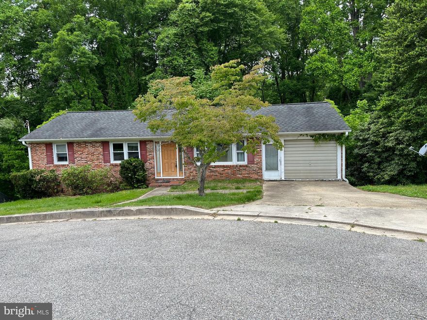 Great Location.  Easy Access to Route 2/4.  Brick house on cul-se-sac.  All wood floors on upper level. New Kitchen appliance.  Large open basement with full bath.  Garage with lots of windows (could be sun room).
