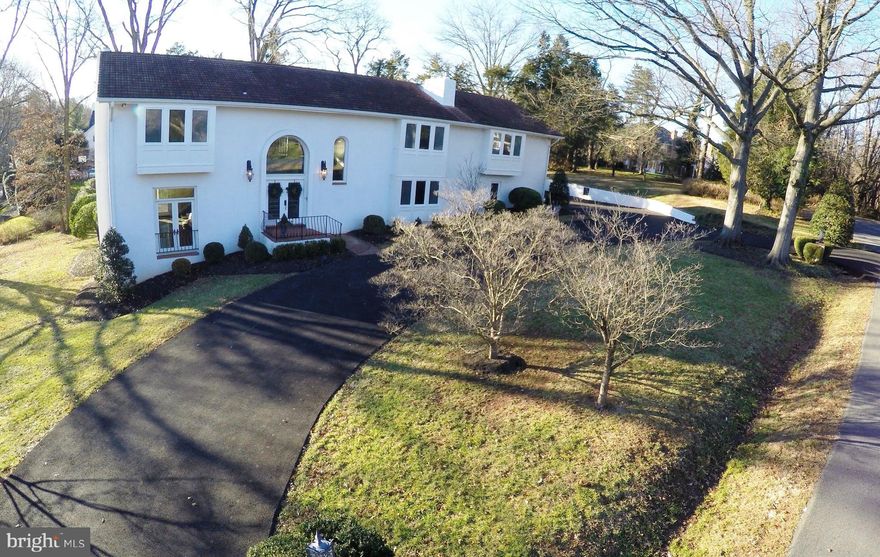 Rarely available! Ballantrae Farm, 1.54 acres, public utilities, less than 2.4 miles from George Washington Memorial Parkway, minutes from Downtown McLean, Tysons Corner, McLean High School and The Potomac School.   Architecturally designed & beautifully constructed Mediterranean Villa on hilltop at the end of a private road. Villa includes 2-story dining room and foyer, formal library with attached full bath, two family rooms, huge living room with high ceilings and access to terrace, 5 bedrooms up including the master suite. 3 fireplaces, hardwood floors, wrought-iron railings   and central vac.