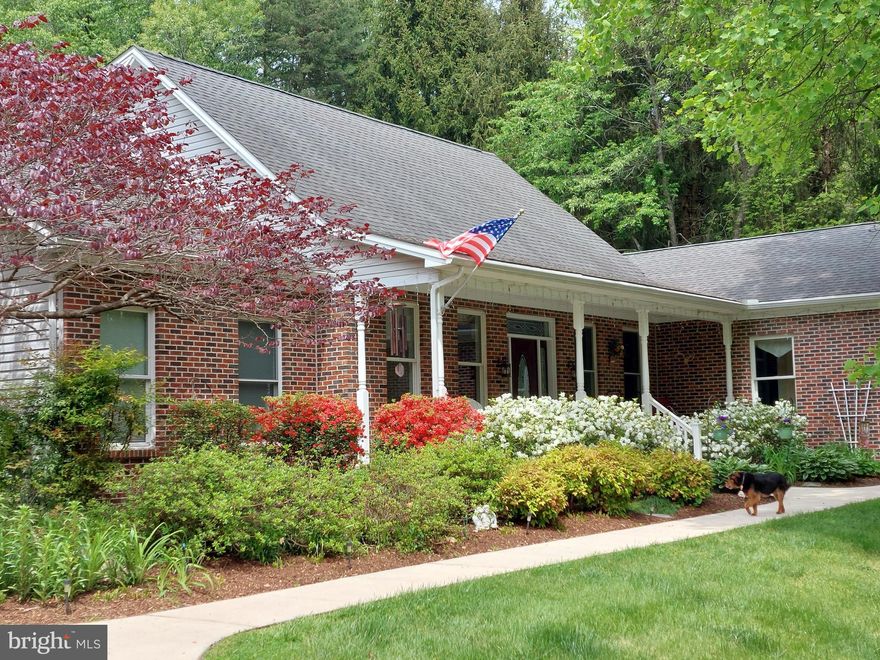 Welcome to this CUSTOM BUILT ESTATE HOME  set on 3.14 private acres, where thoughtful design, quality construction, and peaceful surroundings come together to create an exceptional living experience. Completed in 2008, this beautifully maintained home offers over 5,500 square feet of finished living space, blending functionality with timeless appeal.  Designed as a Contemporary Cape Cod featuring 4 bedrooms and 3 ½ baths, this home is unlike any you have seen!!    A charming covered front porch welcomes you inside, where an expansive, bright and open floor plan unfolds. The main level features a spacious great room seamlessly connecting the living area, dining room, and gourmet eat-in kitchen. The kitchen is designed for both everyday living and entertaining, complete with a large island with glass faced cabinets above and wonderful prep space on the island itself, a breakfast bar peninsula, custom 42” cabinetry, Silestone counters, stainless appliances, a spacious pantry and a sunny and more informal breakfast nook where you are able to look out to the gorgeous rear yard.   The living room is anchored by a Quadrafire wood-burning stove and highlighted by large windows and glass doors with a transom above that lead to the patio, creating a warm and inviting atmosphere where you are able to enjoy your surroundings year-round! A stunning sunroom with walls of windows and transoms offers the perfect retreat, filled with natural light and direct access to the outdoor living space. Also on the main level, your primary bedroom with 2 walk-in closets and primary bath, complete with a soaking tub, separate shower with a built in bench and double vanities, plus a versatile office or 2nd bedroom, a convenient half bath, and a spacious laundry/multi-purpose room with abundant storage.  This room has been customized with partial tile and partial Endura rubber tile - perfect for a few pieces of exercise equipment on this main level in addition to the washer and dryer!    The upper level offers comfortable additional bedrooms, including a generously sized 3rd and 4th bedroom that share a well-appointed Jack-and-Jill bathroom with double sinks and tiled finishes.    The fully finished lower level significantly expands your home's living space, offering a large rec area with a pool table "ready for your enjoyment", an family room area, full bathroom, and a flexible bedroom or guest space. With double-entry doors from the exterior and extensive storage areas, this level provides endless possibilities for entertaining, multi-generational living, or a private retreat.    **    This home is equipped with an impressive list of upgrades and systems designed for efficiency and peace of mind, including geothermal HVAC with three-zone climate control, a Grundfos constant pressure system for consistent, high-pressure water flow, regardless of usage, a whole-house water filtration, an active radon mitigation system, and both a primary and backup sump pump system. Recent updates include a new water heater in 2025, refinished hardwood flooring in 2024, and numerous thoughtful enhancements throughout.     **    Outside, the property offers a private and serene setting with partially fenced grounds, beautifully maintained landscaping, and a patio with a retractable awning - ideal for outdoor gatherings! Additional features include an oversized attached two-car garage with workshop space, walk-in attic storage, and multiple high-end sheds for added convenience.   **  Tucked in an exceptionally peaceful and serene setting while still offering convenient access to major routes, this property provides the perfect balance of privacy and accessibility.  This move-in-ready home blends the charm of country living, yet only minutes away from downtown Bel Air.  You can spend afternoons exploring wooded trails, a small stream on the property or relaxing. A rare opportunity to own a custom home with acreage, modern systems, and exceptional space both inside and out!