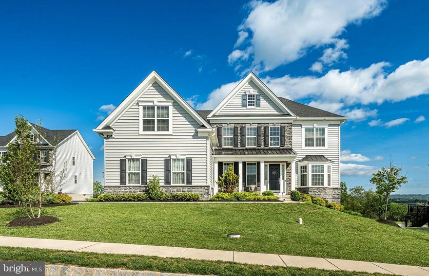 Welcome to 405 Millwright Lane – a beautifully maintained 4-bedroom, 2 full and 2 half bathroom home nestled in the highly sought-after Kimberton Glen community in Phoenixville. From the moment you arrive, you’ll be captivated by the impeccable curb appeal and manicured landscaping that frame the home. Start your mornings peacefully with coffee on the charming front porch. Step inside to a vaulted entryway that sets the tone for the elegance throughout. To your right, a sun-drenched formal living room with large windows welcomes you, while across the entryway, a stylish formal dining room features a striking modern chandelier—perfect for hosting dinner parties or holiday gatherings. Down the hall, the spacious vaulted family room offers a cozy retreat with a gas fireplace and an abundance of natural light. The open floor plan effortlessly flows into the eat-in kitchen, complete with stainless steel appliances, a farmhouse sink, a generous island with bar seating, and sliding doors that open to your private back deck—making indoor-outdoor entertaining a breeze. A versatile bonus room on the main floor provides the ideal space for a home office, playroom, or hobby area, while a convenient half bathroom and a thoughtfully designed mudroom add everyday practicality. The mudroom leads to a spacious laundry room with additional storage. Upstairs, the serene primary suite features plush carpeting, dual walk-in closets, and a luxurious en-suite bathroom with a soaking tub, double vanities, and a large walk-in shower. Three additional well-sized bedrooms offer comfort and flexibility, each with cozy carpeting and easy access to a full hall bathroom. The fully finished basement is an entertainer’s dream, offering expansive space for a home theater, gym, craft room, or whatever suits your lifestyle. A second half bathroom adds convenience, and sliding doors provide walkout access to your back patio and fenced-in backyard. Spend summer evenings relaxing in your private hot tub on the elevated back deck, overlooking your tranquil backyard lined with greenery—a perfect oasis for both quiet nights and lively gatherings. All of this is located just minutes from Phoenixville’s vibrant downtown, local parks, scenic trails, top-rated golf clubs, and everyday conveniences including shopping and dining. 405 Millwright Lane is more than just a house—it's the lifestyle upgrade you've been waiting for. Don't miss your chance to call this exceptional property home!