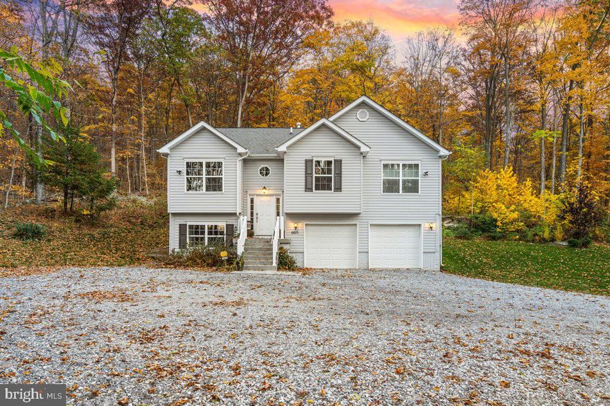 This incredible home has all the bells and whistles! Gleaming white cabinets with granite counter tops adorn the kitchen. The eat in kitchen allows natural light to shine through.  An oversized main bedroom features a spacious walk-in closet and ensuite bathroom with double sink vanity, soaker tub, and walk in tile shower. There is even a finished basement for entertaining with an attached garage for plenty of extra storage! Over 15 acres of breathtaking nature views await you on this mountaintop home. In the summer you can unwind on the deck and enjoy  the abundance  wildlife or take a walk by the stream. Relax by the fireplace in the winter while enjoying nature's beauty from your cozy living room. Only minutes away from National Parks, stock trout streams, hiking , Cunningham Falls, Pen Mar Park, and historic Fort Ritchie. Only 6 miles away from route 15. This is truly one-of-a-kind property that offers endless possibilities for entertainment and maximum relaxation. Home Warranty is being offered.