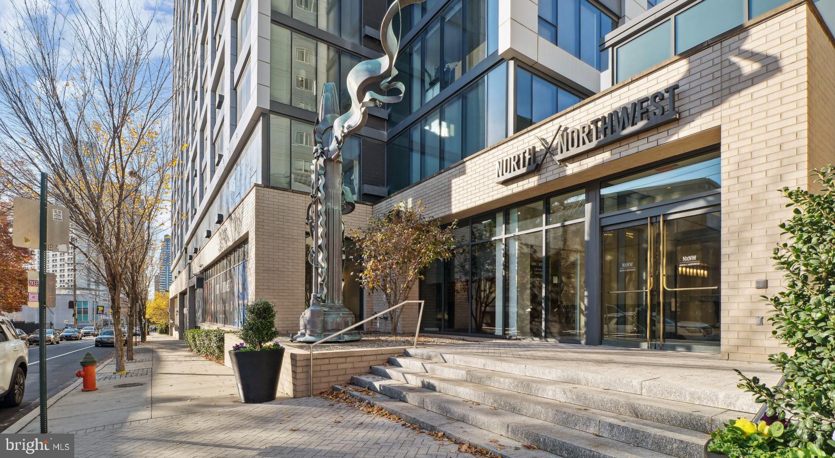 Welcome to NorthXNorthwest, a premier residential destination in Philadelphia’s iconic Art Museum neighborhood where refined living meets modern design, all set against the backdrop of some of the city’s most treasured cultural institutions. Designed for those who seek a vibrant city lifestyle without compromising comfort, elegance, or convenience, NorthXNorthwest elevates apartment living into a curated experience.
The architecture of NorthXNorthwest is a striking blend of contemporary form and urban sophistication, with expansive glass facades and sleek lines that mirror the dynamic spirit of the neighborhood. From the moment you step into the grand lobby, you’re met with a sense of calm and style—soaring ceilings, sophisticated finishes, and thoughtfully designed spaces that instantly signal this is more than just an apartment community—it’s a lifestyle.
Each apartment at NorthXNorthwest is crafted with meticulous attention to detail, offering open-concept layouts that maximize natural light and provide seamless flow from living areas to private retreats. Floor-to-ceiling windows frame sweeping views of the city skyline, Fairmount Park, and the Schuylkill River, while wide-plank flooring, quartz countertops, and premium stainless steel appliances speak to a higher standard of urban living. Spacious kitchens feature modern cabinetry and generous counterspace, perfect for quiet meals at home or entertaining guests. Bedrooms offer a serene escape, with plush carpeting and oversized closets, and spa-inspired bathrooms provide the perfect blend of luxury and function.
But what truly distinguishes NorthXNorthwest is the amenity experience, designed with an elevated urban lifestyle in mind. At the heart of the community is a resort-style rooftop terrace complete with panoramic city views, plush lounge seating, fire pits, and grilling stations—ideal for sunset cocktails or weekend gatherings. The resident lounge is styled like a boutique hotel, offering intimate seating areas, curated art, and ample space to relax, work remotely, or meet with friends. A state-of-the-art fitness center offers top-tier cardio and strength training equipment, along with dedicated spaces for yoga and functional movement training.
For residents who work from home or require flexible workspace, NorthXNorthwest offers beautifully designed co-working lounges with high-speed internet and quiet breakout zones—where productivity meets comfort. A private screening room, on-site café, and indoor-outdoor social spaces provide thoughtful extensions of your home, with design details that reflect the building’s contemporary aesthetic.
Living at NorthXNorthwest also means immersing yourself in one of Philadelphia’s most inspiring and walkable neighborhoods. Step outside and find yourself just moments from the Philadelphia Museum of Art, The Barnes Foundation, Boathouse Row, and miles of trails along the Schuylkill River. The culinary scene surrounding the building offers everything from craft coffee shops and gourmet markets to acclaimed restaurants and hidden neighborhood gems. The streets pulse with energy—lined with tree-shaded sidewalks, historic architecture, and a rich tapestry of culture and creativity.
Future residents will love not just the space they live in, but the life they live here. NorthXNorthwest offers the rare combination of upscale design, thoughtful amenities, and a location steeped in art and culture—all brought together in one of Philadelphia’s most sought-after addresses. It’s more than just an apartment—it’s a place to truly call home.
** Pricing and availability subject to change on a daily basis ** Photos are of model units ** Parking may be available for an additional fee, subject to availability **