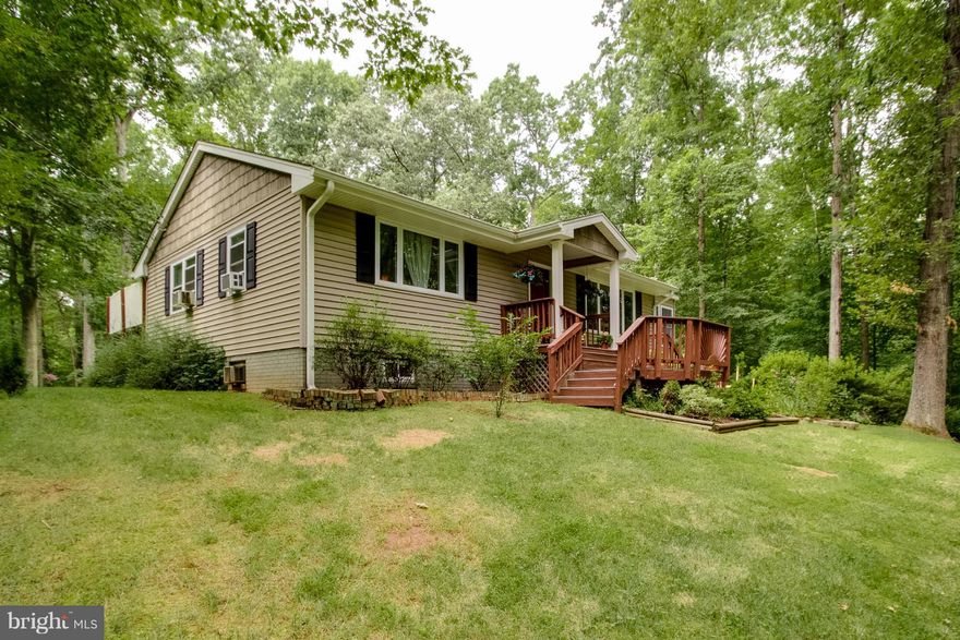 Calling all Nature Lovers!!! Perfect home located at the end of a quiet, no thru traffic street surrounded by mature trees! Special features include: Wood Burning Stove cutting oil bill by 50%, updated kitchen, baths w/granite & decorative ceramic tiles, newer windows, wood floors, Sunroom/Breakfast nook, 16' X 40' Deck, Fire Pit area. Fin walk-out basement w/ large rec room