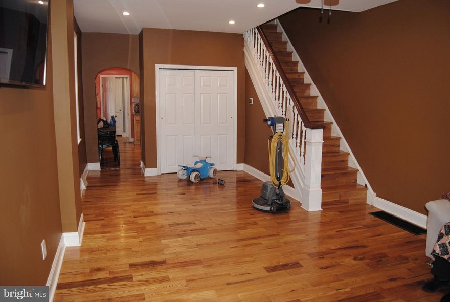 Twin home in prime Tacony . Front covered porch , steel security door . Formal living room with hardwoods floors and ceiling fan . Dining room / living room combo with hardwood floors with recessed lights . Eat in modern kitchen with wood cabinets , granite counter top, gas stove , ss fridge , double ss sink , tiled back splash and recessed lights. Hall to pantry closet , side exit door to private rear yard bbq area , deck , and private fence.  Rear main floor primary bedroom with ceiling fan , hardwood floors , wall closet , modern full bath with stall shower . Finished basement with ceramic tiled flooring , laundry area , office area .Full bath with stall shower . 2nd Fl has rear full bath with ceramic tiled floors and walls with recessed lights . Rear bedroom 2 with ceiling fan and hardwood floors . Middle bedroom 3 with ceiling fan and hardwood floors . Primary bedroom 4 with ceiling fan and hardwood floors . Clean modern home right off I95 , minutes from NJ Tacony Palmyra bridge . Close to shopping and public transportation.