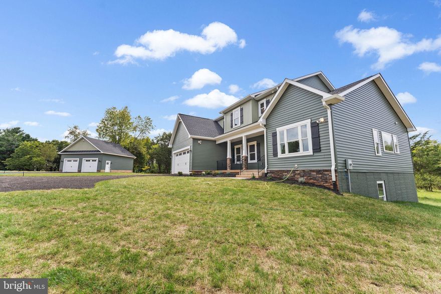 If you're looking for a home that combines the quality and style of a classic with a modern sense of design and layout, look no further . This floor plan is open with a two-story family room, large sun room  off kitchen and a formal Dining room. It offers a first floor master bedroom with volume ceiling, enclosed bathroom featuring  soak in bath tub , separate shower ,double sink vanity and large walk in closet with laundry hook up.. The upstairs  has 3 additional bedrooms , one with enclosed bathroom and 2 other  sharing the Jack and Jill bath .The home comes  with an attached  2 car garage,  as well as a separate detached 2  car garage featuring upgraded insulated  carriage style doors.All main level  has hardwood floor..Rough in for ceiling fan in all bedrooms , lots of recess lights, upgraded trim , crown molding in almost all the rooms...    Enjoy the privacy and peace that comes with  a little over 4  acres , no HOA  only 10 minutes from the VRE, I66, Rt. 234, Manassas, Bristow, shopping and more!