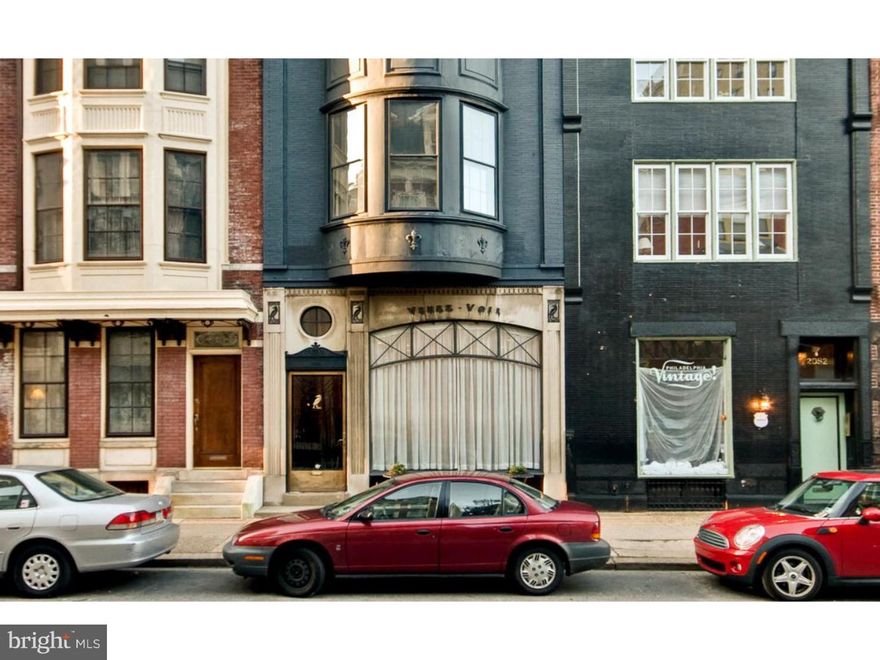 Unique 4 story 19th century townhouse with exquisite 1920s facade. Fabulous location steps from Rittenhouse Square. Over 4000 sqft, elegant and bright with original details throughout, high ceilings, wood floors and original stairway. Large living room with bay windows, fireplace, extensive original bookcases and moldings, 11' ceilings, powder room and coat closet. Large, recently updated separate kitchen with gas cooking, dishwasher, garbage disposal and excellent storage and counter space. Granite counters in kitchen. Fabulous dining room with fireplace and leaded windows opening to sundeck, original built-in cabinetry. 3rd floor master bedroom suite with closets and bay window, bedroom and 2 full tiled baths. Newly remodeled master bath with stone counters and trim. Library sitting room with corner fireplace. 4th floor, 3 bedrooms and 2 full baths plus laundry room with washer/dryer (Miele). 1st floor open space with 10 foot ceilings. Use as office, in-law suite extension to single family house. Powder room.  Space behind house has been used as a parking space for the last 40 years.  Gas hot water, heat and 4 zone central air. Huge basement storage and wine cellar.