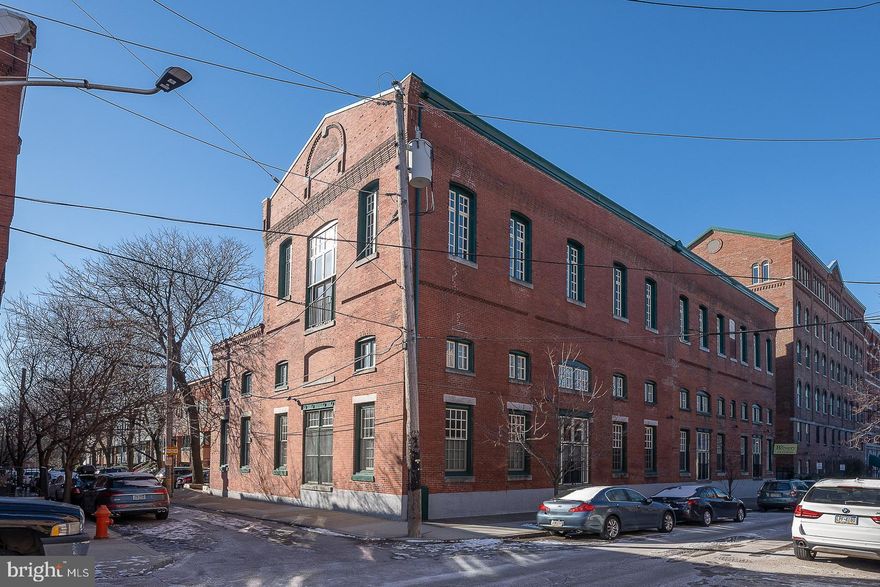 A spectacular, uniquely designed, corner 2-story, 2 bedroom/1.5 bath loft condominium home with One Parking Spot located at The Brewery Condominiums! Nestled in the coveted Art Museum Area, the first floor of this "townhouse-like" home showcases a dramatic, sun-filled living room with 3 tall windows & recessed lighting; a separate dining room with a stunning, large floor-to-ceiling window; modern kitchen with SS appliances, granite counter tops, impressive cabinetry, tile backsplash & a charming French door window. The lovely powder room completes this level. The second floor offers a large, open, loft style bedroom overlooking the living room; an upgraded full bathroom; a second spacious bedroom, and a good-sized attic for additional storage space! Gleaming hardwood floors throughout.  The capital contribution due at settlement is 4 months' condo fee plus $500. Seller is willing to split that cost at the the time of settlement. The Brewery offers a bike room and a fantastic roof-top deck! This exceptional home is an easy, short drive to UPenn, and is very conveniently located to I-76, Boat House Row, Kelly Drive and Lemon Hill Park!