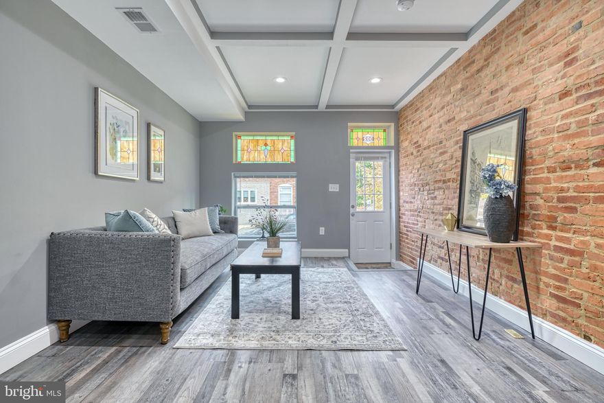 Beautiful fully renovated home in Greektown, steps away from all new development and trendy shopping plaza.  The house was fully renovated sparing no expense. The main level welcomes you with an airy light-drenched living room with oversized windows with original stained glass, custom trim, new floors throughout, offering also newly renovated eat-in kitchen with crisp wood cabinets, trendy backsplash, quarts counters and stainless appliances,  Second floor welcomes you with two en-suite bedrooms and a walk out deck. Lower level is a perfect set up for a roommate or a guest area, featuring its own bedroom/den and a full bath. Parking pad is another bonus to this home. Steps away from Bayview, close drive to Canton, and easy access to I-95 and I-895.