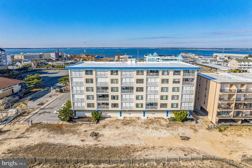 Get ready to be swept away by the breathtaking views of the Atlantic!  If you're a fan of sunrises over the ocean, you're going to fall head over heels for this unit. This beautifully renovated, 2-bedroom, 2-full bath condo is a gem in the heart of mid-town Ocean City, Maryland. The desirable Mooring Condo Building provides a perfect blend of oceanfront living and easy access to the town's vibrant amenities.
As you enter, you'll be greeted by a flawlessly maintained living space. The open-concept living room and dining area provide oceanfront views from every angle. A sliding door gives access to a balcony where you can immerse yourself to the sound of the crashing waves. The oceanfront primary bedroom has breathtaking views, a private bath, and balcony access. The second bedroom, spacious enough for two queen-size beds, offers bay views, creating an ideal retreat for guests or family. Adjacent to the 2nd bedroom is where you will find the updated hall bath. The well appointed kitchen features modern cabinets, newer appliances, a quartz countertop and a generously sized pantry. You have the convenience of in-unit laundry and additional storage. This immaculate unit is mere steps from the beach.
Enjoy your morning coffee on the oceanfront balcony as you take in the beautiful sunrise over the water. In the evening, unwind on the other side of the building and witness stunning sunsets with bay views – a truly magical experience. Don't miss the chance to own this fully furnished oceanfront oasis. Schedule your private tour today and make beach life a reality!  
Upgrades to this absolutely spotless unit include the replacement of both sliding doors and bayside window, appliances, water heater (2016), HVAC (2016), storm door (2022).  Building exterior to include balcony railings (2017), building roof (2019). The current owners have never rented this unit.  
Seize the sunshine vibes! Buy this oceanfront condo now and get ready to soak up the summer fun!