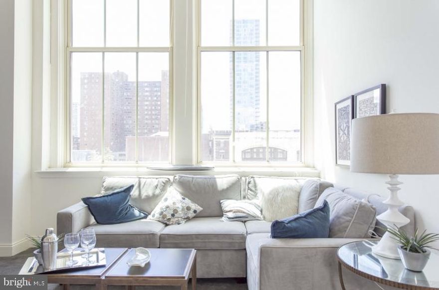 AVAILABLE FOR A JUNE LEASE START DATE! Enjoy living in this former tuxedo warehouse which has been transformed into fabulous loft style apartments! 2121 Market Street Apartments offers stunning city views!  Located in the Rittenhouse Square neighborhood, the spacious apartments feature super high ceilings with expansive 14-foot windows, hardwood floors, open floor-plans and amazing natural light.  The kitchens are fully equipped and include a breakfast bar. Amenities include a resident sky box with a state of the art fitness center and resident lounge, roof deck with breathtaking city views, 24/7 front desk attendant.  We love pets! The building is super pet friendly and welcomes dogs and cats. Trader Joe's is conveniently located on the lower level.  Enjoy everything that the city has to offer at 2121 Market Street. **Photos pictured are of the model unit with a similar floor-plan**