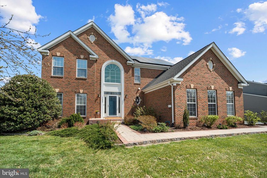 Welcome home to comfort, space, and peace of mind in this beautifully maintained 4-bedroom, 2.5-bath colonial set on a partially wooded 0.57-acre lot. Built in 2001 and offering nearly 3,000 square feet of above grade living space, this brick-front home blends timeless design with thoughtful upgrades ideal for modern living.

Step inside a gorgeous 2-story foyer and continue to find 9-foot ceilings and hardwood floors throughout the first level.  The heart of the home is the updated kitchen and morning room, complete with granite countertops, 42" cabinets, accent lighting, and stainless steel appliances, making meal prep and busy mornings a breeze. The family room overlooks the spacious kitchen and vibrant morning room, rounding out a space that is perfect for both everyday living and special gatherings.  The adjacent deck extends your living space outdoors with views of the expansive backyard.  Elegant pillars separate the living and dining rooms,  and a home office/den provides a quiet space for remote work or homework.  

Practical upgrades throughout the home include an upgraded primary bathroom, new carpets in all upstairs bedrooms, dual-zone heating and cooling, a new high-efficiency furnace (2023), on-demand hot water, water softening and filtration systems, and fully paid-off solar panels with transferable warranties helping keep utility costs low for years to come.  The partially finished basement adds over 1500 square feet of flexible living and recreational space, including an extra half bath, woodworking area, and durable epoxy floors. 

Additional highlights include beautifully manicured landscaping throughout yard, a 2-car garage with epoxy floors and smart openers, expanded driveway for extra parking, programmable exterior lighting, minimal HOA fees, and a newer roof(2018).

This warm, welcoming home offers the space, features, and reliability today's homeowners are looking for, all in a peaceful setting designed to grow with you.