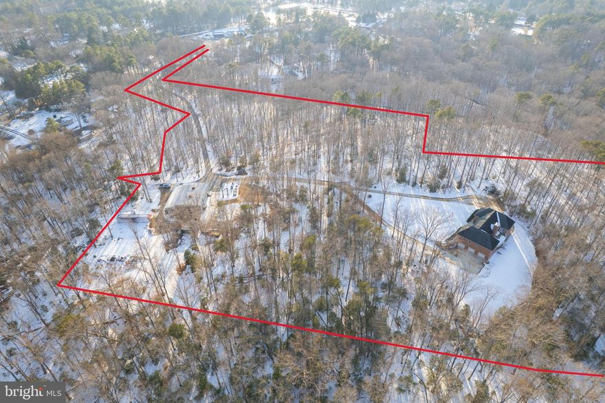 SHOP AND RESIDENCE on 18+ ACRES. All brick rambler on 18.64 acres of wooded, private land offering exceptional craftsmanship and versatility.  Geothermal heat pumps and Andersen windows, extensive power supply specs are just a couple of the steps taken by the owner to make this a long-lasting home. Dual shop areas on the property. A 3 bay space in the lower level of the home and a large shop buiding separate from the home address.  The 4-bedroom, 4.5-bath brick residence features a massive central great room with vaulted ceilings and a striking masonry fireplace with custom wood elevator.  The adjacent gourmet kitchen is designed for both function and style, featuring stainless steel appliances, custom backsplash, and a huge center island. The large main level owner's suite is large in scale with huge closet and bath. Owner's shower has body sprays, corner tub is jetted! This suite also enjoys access to the rear patio. Two more large bedrooms share a second full bath, and the laundry room is on this main level as well. The entire floor plan is perfect for large gatherings, making lasting memories, holiday events. The finished basement includes a small in-law apartment, mechanical room and storage, room for a large recreation room. Outdoor living areas are equally impressive, with two levels of poured concrete patios, including a built-in grill station off of the kitchen. Car enthusiasts and hobbyists will appreciate the two garages within the home, totaling 5 bays. Lower level garage has another full bath, room for multiple vehicles and shop area, perfect for collectors and mechanics. SHOP BUILDING- a 55 x 60  shop with 14 x 40 addition, covered slab off the back and other various outbuildings for storage various tools and equipment conveyances, offering endless possibilities. Multiple uses with motor lifts, plasma table, air hoist on steel beam from front to back of the main space. The property is conveniently accessible to Route 5 and Route 235, offering easy access to shopping, dining, and commuter routes. SOLD AS IS.