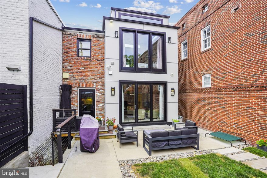 Get ready to be wowed!  Move-in ready! Modern living meets the charm of Old Town Alexandria*Total transformation in 2021 of this expansive, turn-of-the-century rowhome with nearly 3000sqft of living space*Full rear addition on all three levels*Main level boasts stunning chef's kitchen with marble countertops, porcelain tile floors, custom cabinetry, top-of-the-line SS appliances, large island and walk-in pantry*Bring the outside world in and expand your entertaining flow to the patio and back yard with retractable doors off kitchen/family room*Wide-plank hardwoods adorn the living, dining areas and upper level*Mantled wood-burning fireplace in living room*Two ensuite bedrooms upstairs including opulent primary bedroom with wall of windows, volume ceiling, large 14x8 walk-in closet and to-die-for bathroom with porcelain tile, frameless shower doors, jetted soaking tub, dual vanity and separate water closet*Laundry room on upper level with cabinets galore and folding area*Fully finished walkout lower level has generous-sized rec room and bedroom #3 with access to full bath*Two-car parking pad in rear*Custom lighting thruout*All new plumbing and eletrical*New roof, HVAC and tankless HWH*ERA specific energy efficient windows*All powerlines and cable lines have been buried*Location, location, location! Minutes to King St and Braddock Rd Metro stops, restaurants, pubs, shopping and more*Easy access to major routes and airport*1yr home warranty conveys