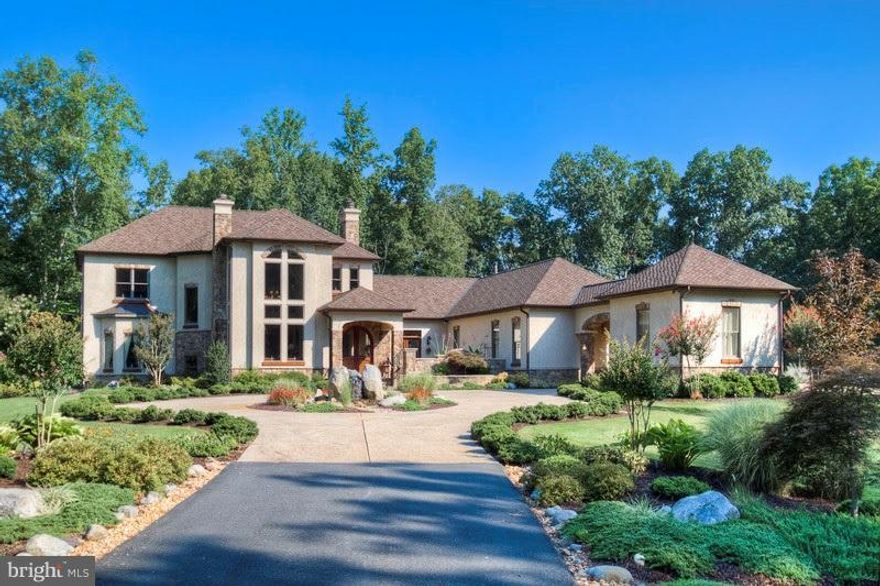 Immaculate LUXURY Estate on 26+ Acres! 5-Car Garage/workshop- backs to PROTECTED AREA! 6 Fireplaced Rms! Turned Staircase! Pine Beams!Entertainment Bar w/ Pizza Oven! Main Floor Master w/ Coffee Bar, Patio & Luxury Spa Bath!INDOOR POOL! OfficeiS! Finished LL! Theater Room! Private Garden,Courtyard & Fountain!Hand Carved Doors! 50 yr roof! Room for exterior Pool/ Putting Green!Extra Perc-add on!