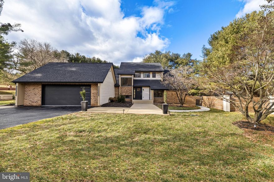 Welcome to a rare retreat in the heart of Cockeysville — a spacious contemporary home tucked into a serene, wooded setting and offering the kind of privacy, scale, and potential that seldom comes to market. Set on 1.45 acres in the sought‑after Morningside/Laurelfold area, 12206 Cleghorn Rd with a just completed total renovation offers a custom contemporary design with more than 5,000 square feet of finished living space (over 7,500 square feet total per public records) and a flexible layout ideal for multi‑generational living or thoughtful modernization. The main level features expansive gathering areas with soaring ceilings, large windows, LVP flooring, great room with wet bar and an open flow that invites natural light throughout. The stunning vaulted kitchen with top-of-the-line appliances and quartz counters also includes a breakfast area with wood-burning fireplace. The primary bedroom with marble spa bath and an additional main‑level bedroom option with a hall bath. The lower level offers a  second kitchen, exercise room, office  and multiple entertaining spaces, adding versatility for guests or extended family. The home includes four bedrooms, four full baths, a kitchen fireplace, and generous room sizes throughout. Outside, the deck with cooking center, brick walled patio and gazebo create a peaceful retreat. The deep flat back yard offers additional possibilities. Just minutes from Hunt Valley conveniences, commuter routes, and top‑rated Baltimore County schools. This is an exceptional opportunity for buyers seeking space, privacy, and the chance to personalize a substantial home in one of the area’s most desirable luxury corridors.