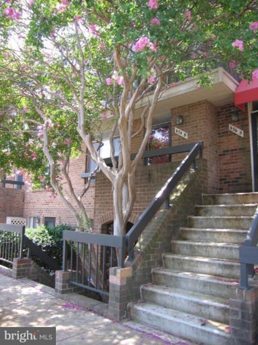 Sunny Upper Brick Townhouse with 2 bedroom master suites!  Updated bathrooms & Brand New Carpet thru-out.  Beautiful kitchen with granite counter tops, stainless steel appliances, wine cooler and sitting area.  Large dining room/ living room with wood burning fireplace.Tranquil setting views of trees! Fabulous location across from Pentagon City Metro/Fashion Centre! Parking in front of Townhouse