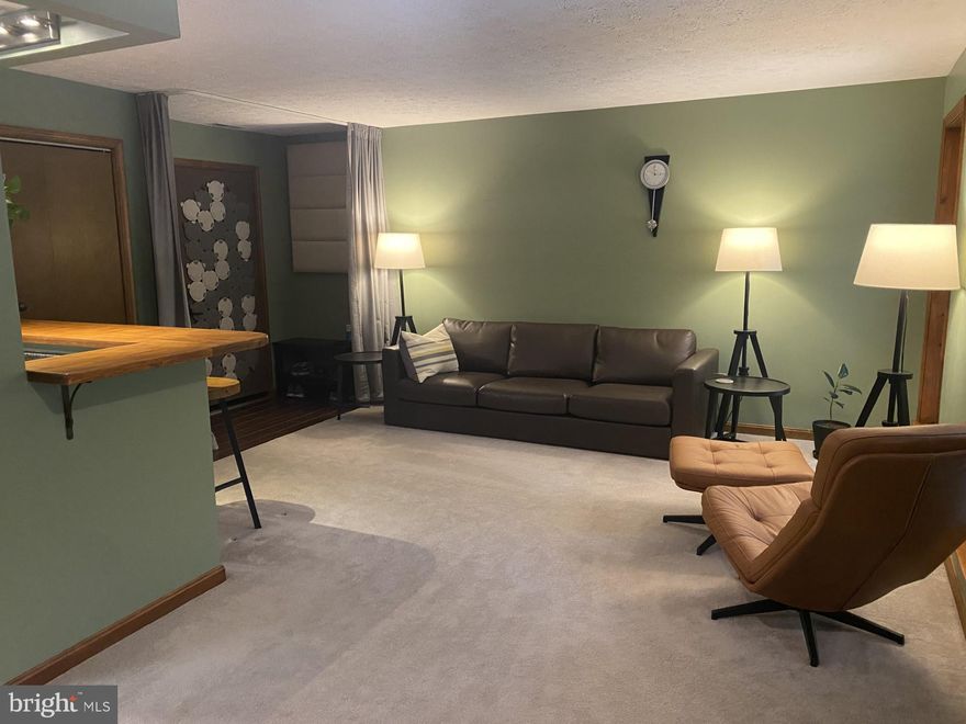 Beautiful lower-level condo in pristine condition is looking for new owners.  Nice open floor plan with kitchen bar seating.  Unit backs to trees for extra privacy and walks out to covered patio.  2 bedrooms and 1.5 baths.  Half bath is off of the primary bedroom.   Centrally located near restaurants, shopping and schools.  Easy commute to Pax River NAS.  This unit is absolutely move in ready so schedule your appointment today!