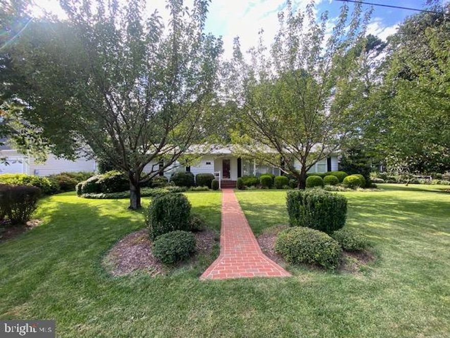 Inviting Ranch-Style Home with Chesapeake Bay Views
Welcome to this charming ranch-style retreat where comfort meets coastal living. Nestled on a beautifully landscaped lot with views of the Chesapeake Bay, this home invites you to slow down and enjoy peaceful surroundings. Step inside to a bright, open layout connecting the kitchen, dining, and living areas, centered around a cozy two-way wood-burning fireplace and accented with elegant crown molding.

With three spacious bedrooms and two full baths, there’s room for everyone to relax. The large family room is perfect for movie nights or gatherings. Outside, unwind on the brick patio under the pergola, listen to the pond’s gentle sounds, and take in the beauty of the wide, level yard. A carport, extra driveway parking, and a storage shed add convenience.

Enjoy a friendly waterfront community with walking paths to the beach, a boat ramp, clubhouse, and more. Shopping, dining, and the charm of Solomons Island are just moments away, with an easy commute to Patuxent River Naval Air Station.