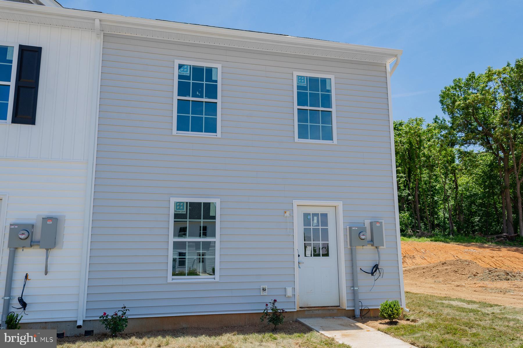 One of the last end units available for this model and its Immediate delivery! The builder is offering 3% in closing cost! This spacious townhouse has 1, 440 square feet of living space. Inside, you'll find a large L-shaped kitchen with plenty of counter space, modern appliances, and storage. The layout connects the kitchen to the dining and living areas, perfect for social gatherings. The family room is bright and inviting with large windows, ideal for relaxing and entertaining. Upstairs, there are three bedrooms. The primary bedroom has an ensuite bathroom, and there are two and a half bathrooms in total for everyone's convenience.