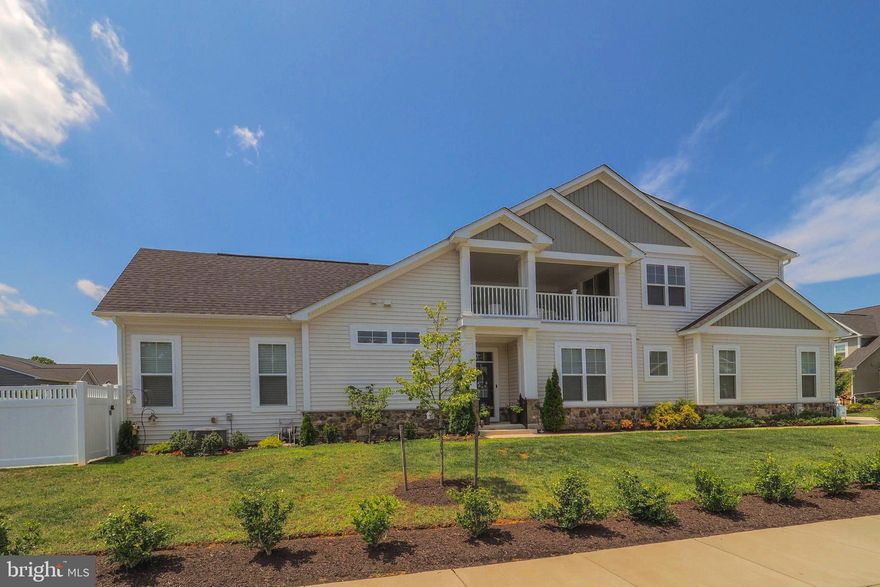 Welcome to this magnificent home  in the Two Rivers community! This end-unit villa on a quiet street in the premiere 55 plus community boasts unobstructed views of surrounding greenery. As you enter the gracious foyer you’ll be impressed with the open floor plan, 10 foot ceilings and gorgeous hardwood floors. A great room with coffered ceilings, built-ins and a gas fireplace opens to the well-appointed gourmet kitchen with stone counters, stainless steel appliances, gas cooking and large pantry. In addition to the large center island that provides kitchen seating, the adjacent formal dining room is perfect for hosting larger gatherings. Just off the great room is a generous screened porch for additional entertaining or simple relaxing with a cup of coffee. The owner’s suite on the main level offers a walk-in closet and en suite bathroom with quartz countertops. A second bedroom with a connecting full bathroom and laundry/mudroom with access to the attached 2-car garage complete the first level. As you make your way upstairs you are greeted by a family room flooded with natural light, a third bedroom, full bathroom, large storage closet, and access to a covered private porch. The finished lower level recreation room has a full bathroom and ample storage. Don’t miss this chance to be part of this amazing community with countless amenities including a Clubhouse, indoor/outdoor pools, fitness rooms, pickleball and tennis courts, and walking trails. Enjoy a convenient location close to major commuter routes and nearby attractions. 
Recent Additions added back yard Patio and stairs,  vinyl privacy fence,  California Closets is a must see, 3 ceiling fans,  Kitchen Pantry,  dimer switches kitchen, dining room, and rear covered porch.