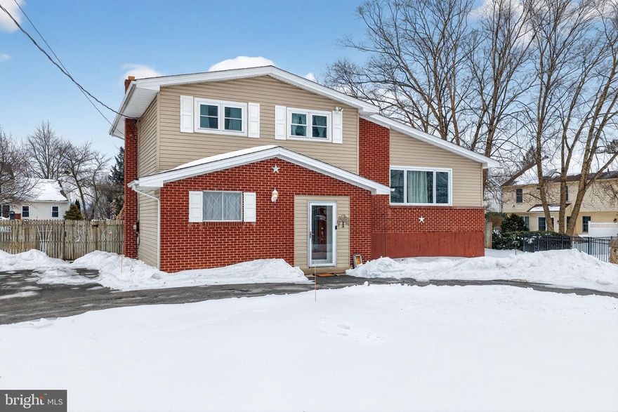 Nicely maintained Split-Level Home with Vaulted Ceilings, Updated Kitchen & Expansive Outdoor Space! Enter through vestibule doors into a generously sized foyer and laundry room. Step down to your 4th bedroom or office.  Also a Mechanical room offers easy access to the backyard. Upstairs, you’ll find a bright Living Room with laminate flooring and a vaulted ceiling. The Kitchen and Dining Area is appointed with beautiful soft-close cabinetry, granite countertops, an oversized granite island, built in shelving, tile backsplash, farmhouse sink, stainless steel range hood, Café brand electric double-oven range & dishwasher. A sliding glass door leads to an oversized 20' x 20' rear wood deck. A patterned concrete patio, fully fenced yard, garden boxes, two storage sheds, fire pit & charcoal grill complete your wonderful yard. The upper level offers an updated full bath with ceramic tile flooring and an oversized tiled shower, Primary Bedroom with walk-in closet, plus two additional bedrooms. The lower level features a cozy Family Room with built-in bookshelves, a rec room and access to a concrete partial crawl space for storage. Additional highlights include oil hot water heat, mini-split A/C in the Living Room and Kitchen/Dining areas and an expansive horseshoe driveway providing convenient off-street parking for a dozen or more vehicles. Roof-2015. Clear Bethlehem Township CO.