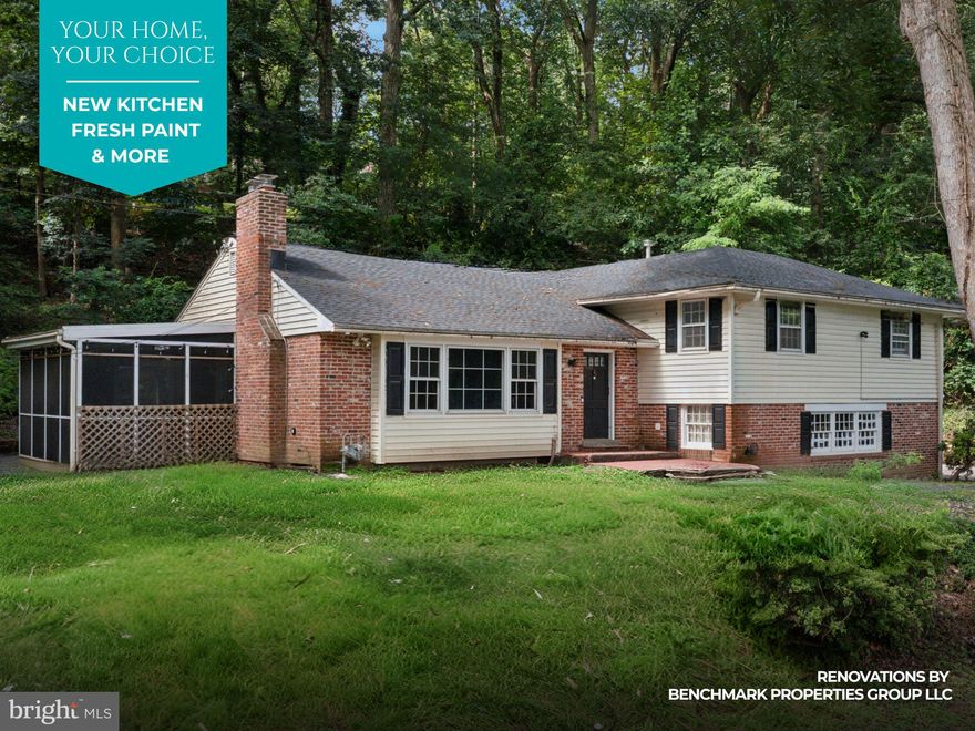 Benchmark Properties Group LLC is transforming 542 Upper Weadley Road—giving buyers a rare chance to customize a beautifully situated home in Wayne’s sought-after Tredyffrin-Easttown School District. On a private 0.65-acre lot, this 4-bed, 2.5-bath split-level will soon feature a brand new kitchen with your choice of cabinetry, granite or quartz countertops (Level 1 or 2), and backsplash, plus refinished hardwood floors and fresh interior paint throughout—all color selections are up to you. This spacious home offers classic charm and flexibility: a sunlit family room with custom built-ins and fireplace, a formal dining room that opens to a screened-in patio, and a lower-level den with exposed beams, second fireplace, powder room, garage access, and large basement. Upstairs, you'll find four generously sized bedrooms including a primary suite with en-suite bath. With solid bones, a thoughtful layout, and high-end upgrades underway, this home is a rare chance to personalize your dream Main Line property—without the hassle of managing a full renovation yourself. Note: Pictures are virtually staged and do not represent the final finish kitchen, floors, or paint colors.