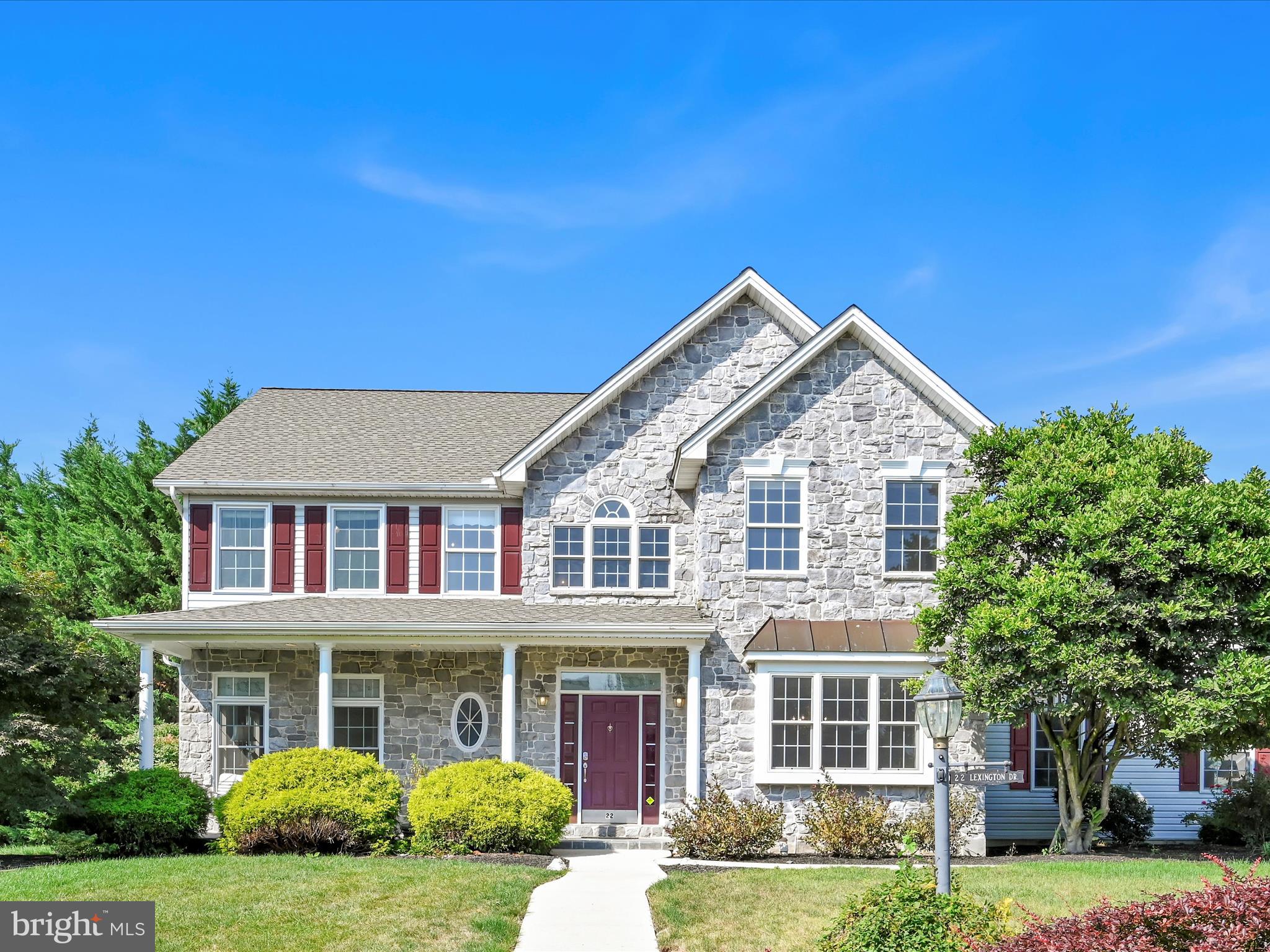 Welcome home... to this stately stone colonial two story in the desirable Olde Stone Way community (Palmyra Area School District). This beautiful home boasts 5 bedrooms, 3.5 bathrooms with over 4,500+ square feet of living space. Special features include: 2-story open foyer with turned staircase, 2-story family room with stunning stone fireplace, custom kitchen with updated countertops and high-end appliances. The first floor offers a formal living and dining room, first floor laundry/mudroom, half bath, screen porch off family room with access to paver patio and gas firepit. The second floor offers a spacious primary suite with walk-in closet, private bath with jet tub and walk-in shower. There are three additional bedrooms and large shared hall bath. The professionally finished lower level, has a full bath, bedroom (with egress), home office, bonus space, and large living area with wet bar, refrigerator, surround sounds theater system, and additional storage. There is an oversized two car garage with additional storage. Large corner lot with lots of privacy and great outdoor living space with front and rear porch/patios. Added value of a NEW roof (2025), NEW HVAC (2023), NEW carpeting on the second floor, several new windows, fresh paint and flooring, and more make this an even better reason to call 22 Lexington Dr home. Schedule your private showing today!
