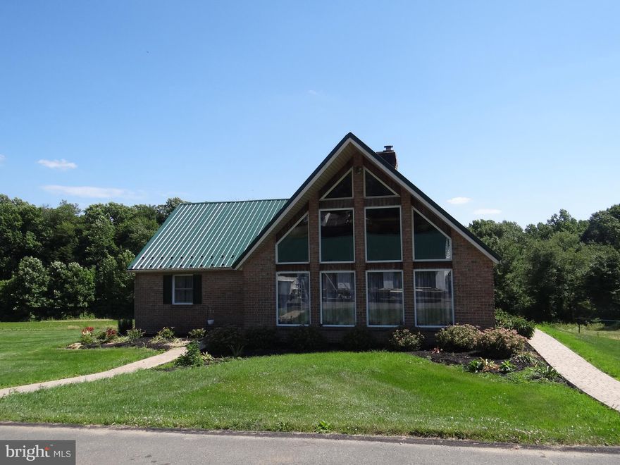 Here is a unique opportunity to live in the country on a 40+ AC property with a 3BR Chalet-style home, a large detached 5-bay garage, a bank barn and several Agricultural storage buildings. The home features an open first floor with a 2-story living room, HW flooring and a stone-hearth fireplace. There are 2 BR's and a full bath on the first floor as well as a combination kitchen / dining area and a set of sliding doors which lead out to a 3-season sunroom. Upstairs you find the primary BR w/ full bath including a whirlpool tub and a stall shower. The monthly rent includes the house and detached garage. The farm fields are currently rented but the barn and storage buildings could be utilized for an additional fee. Tenants are responsible for all utilities, lawn care, snow removal and trash. The owner would prefer no pets but may consider a pet for an additional fee. A nice rural location on a dead-end road in Honey Brook Twp. Not your typical rental.
