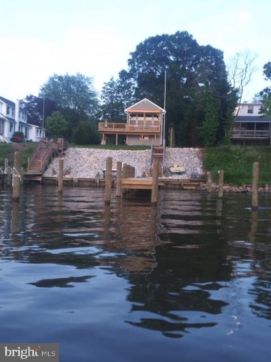 Rarely available and absolutely stunning waterfront view on the Bush River. Prime waterfront located in Perryman. Brand new construction with plenty of space to entertain or add that garage/workshop. Tax record doesn't depict true finished sq footage.  Home has approximately 950 +/- sq ft.This home is pristine and move-in ready.   Covered deck to enjoy the beautiful sunrise and sunsets over the water. Bulkhead and pier built in 2018, includes water and electric.  Elevated views and a perfect setting. Includes well and brand new septic system.  No HOA.  No flood insurance required. Hurry this won't last. Includes hurricane rated windows, R48 insulation in the attic, 2x6 walls.