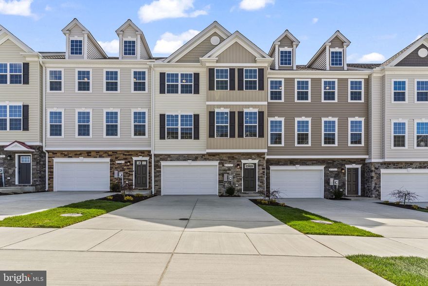 Homesite 141 - Oakley D1 End Unit at Meadows at Town Run II   ****October Delivery****    
***Choose your color schemes from one of our color schemes****

2,966 Sq Ft | 4 Bedrooms | 3.5 Baths | 1-Car Garage. Discover the spacious Oakley D1 end-unit townhome at Meadows at Town Run II, crafted by Quality Built Homes and located in the heart of Leonardtown, Maryland. This expansive 2,966 sq ft home offers generous living areas, abundant natural light, and the perfect blend of functionality and style.

The main level welcomes you with a finished rec room or optional 4th bedroom, complete with a full bath, wet bar and access to your backyard—ideal for guests, a private office, or a second living space. The oversized one-car garage and wide driveway provide ample parking and storage options.

Upstairs, you'll find 9’ ceilings, luxury vinyl plank flooring, and a beautifully appointed kitchen with 42” upgraded maple cabinetry, slide-out dovetail drawers, soft-close features, back splash and granite countertops. The large center island, walk-in pantry, stainless steel GE appliances, and open-concept layout make this a true entertainer’s dream. The adjoining dining and family rooms lead out to a 14x12 maintenance-free deck overlooking your vinyl-fenced backyard.

The upper level includes a luxurious owner’s suite with a tray ceiling, walk-in closet, and ensuite bath featuring dual vanities and QBHI’s signature deluxe tiled shower with bench, dual showerheads, and recessed lighting. Two additional bedrooms, a full hall bath, and a separate laundry room complete the top floor. Tile and quartz or granite in the bathrooms. 

Additional highlights include: finished and painted oversized garage, smart home technology with touchscreen IQ Pro command center, Skybell video doorbell, and smart thermostat, sodded and landscaped yard, stone-to-grade front (per elevation), concrete front porch, and seamless gutters, 6’ vinyl fenced backyard with gate. 

Community amenities include clubhouse, pool, playground, tennis courts, and pickleball courts.  Photos shown are representative and intended to illustrate a similar finished townhouse.